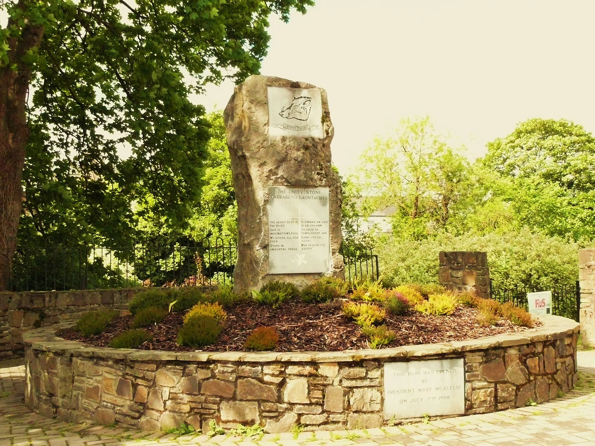 Photo showing: Image of The Unity Stone, a monument at the entrance to the Kanturk Public Town Park. The text on the base plaque reads:
This Park was opened by President MaryMcLeese on July 7th 1998.