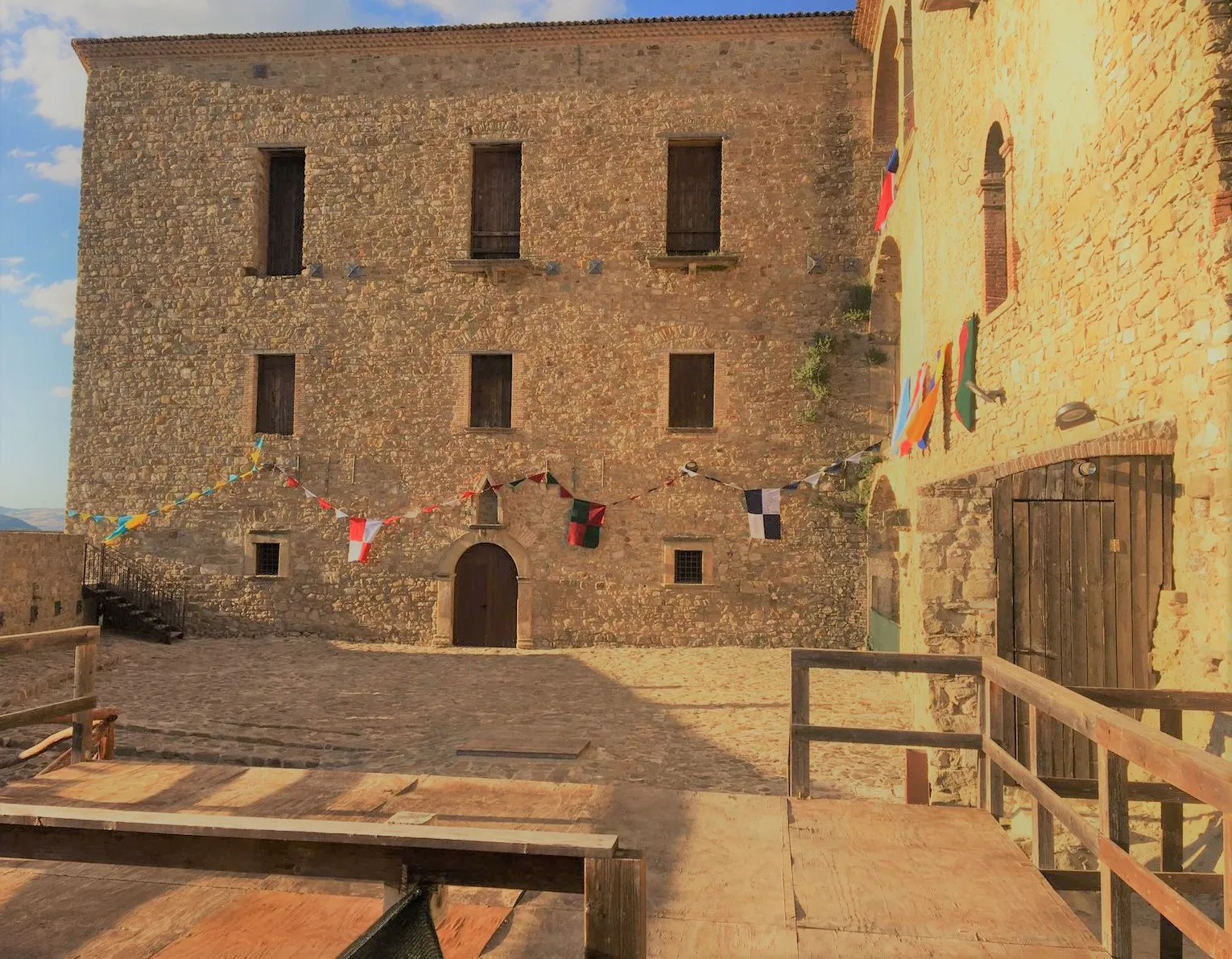 Photo showing: Laurenzana Castle seen from the inside, there are the flags of the four districts of the Carmelite Palio