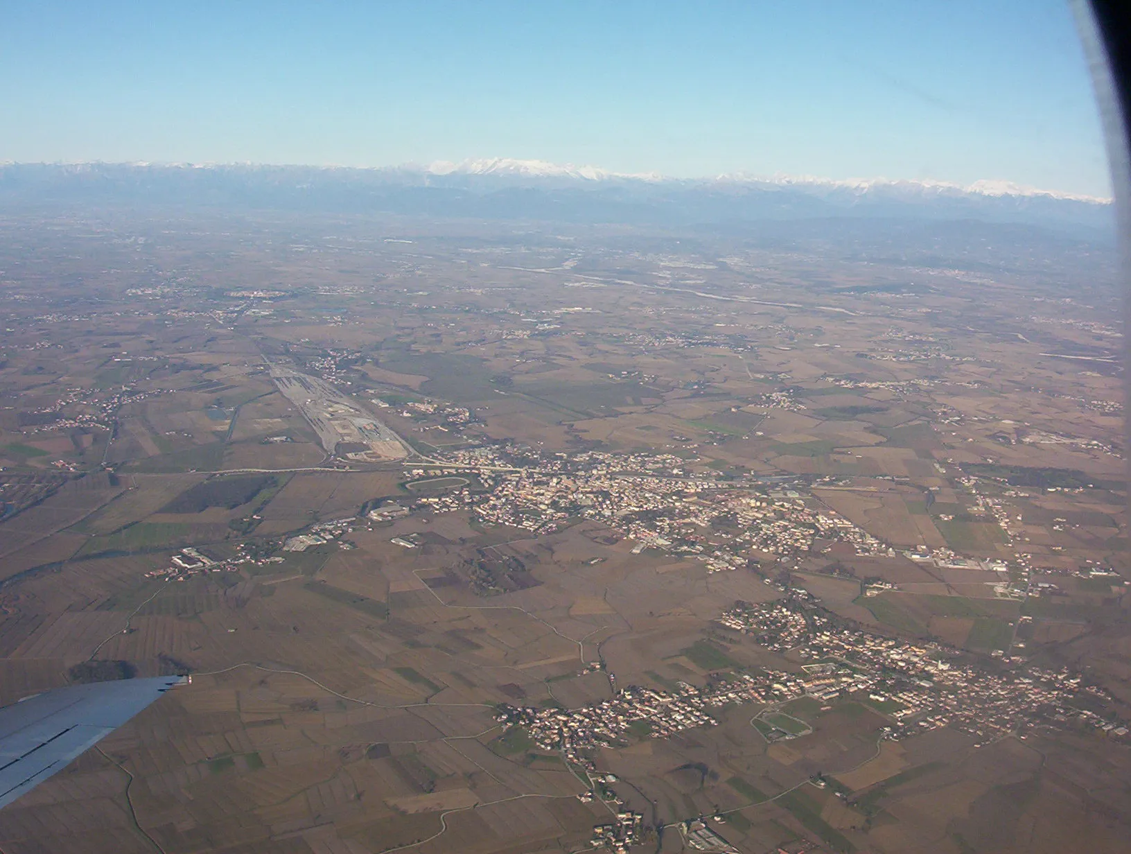 Photo showing: A view of Cervignano del Friuli and Terzo di Aquileia (two villages near Udine, Italy) in a photo by Trevirgola. December 2004.