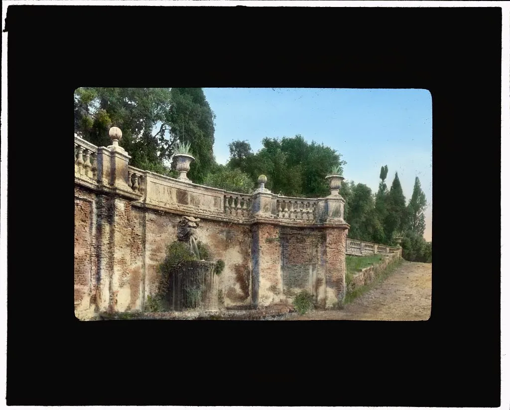 Photo showing: Johnston, Frances Benjamin,, 1864-1952,, photographer. [Villa Torlonia, Frascati, Lazio, Italy. Wall fountain]
[1925]
1 photograph : glass lantern slide, hand-colored ; 3.25 x 4 in. Notes: Site history. Landscape: Girolamo Fontana, Carlo Maderno, and Flaminio Ponzio, seventeenth century. Also, Scipione Borghese. Other: Also known as the Villa Conti.Today: Gardens are a public park.
On slide: Yellow-gold star sticker.
On slide (printed): "Edward Van Altena" and "71-79 W. 45th St., N.Y.C." (slide manufacturer).
Slide for lecture "Old World Gardens."
Title, date, and subject information provided by Sam Watters, 2011.
Forms part of: Garden and historic house lecture series in the Frances Benjamin Johnston Collection (Library of Congress). Rights Info: No known restrictions on publication. Repository: Library of Congress, Prints and Photographs Division, Washington, D.C. 20540 USA, http://hdl.loc.gov/loc.pnp/pp.print Higher resolution image is available (Persistent URL): http://hdl.loc.gov/loc.pnp/ppmsca.16538
Call Number: LC-J717-X104- 82