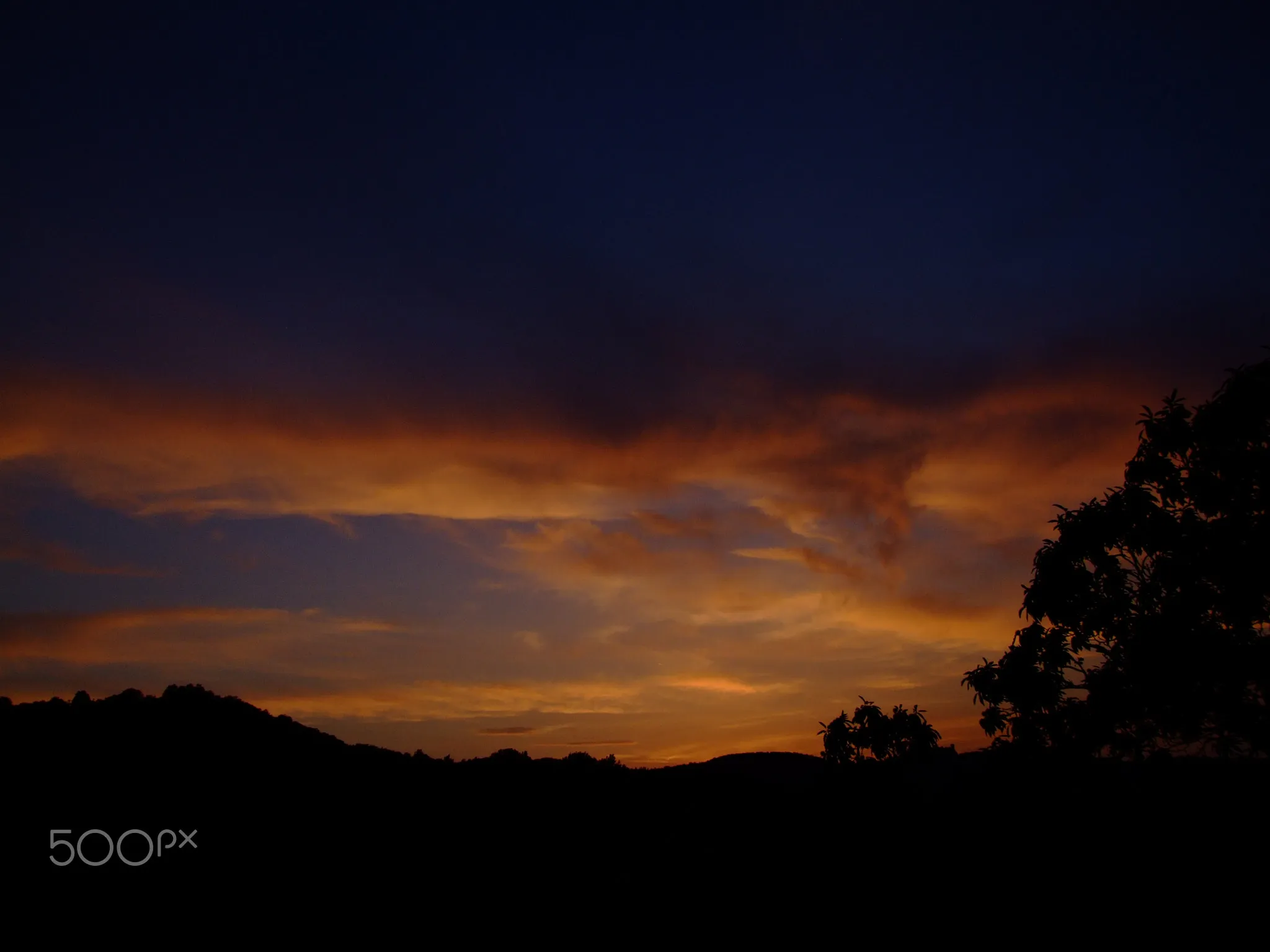 Photo showing: 500px provided description: Red and orange sunset in my village. [#red ,#sunset ,#sunlight ,#clouds ,#creative ,#photo ,#photography]