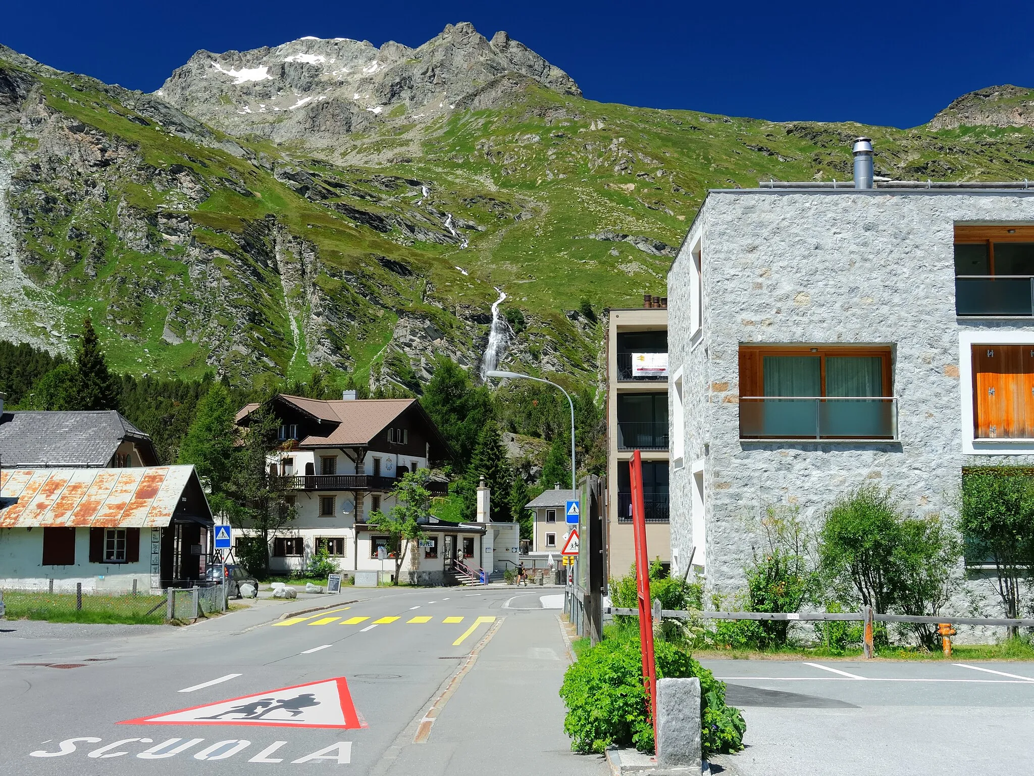 Photo showing: Maloja, main street. View from near the 1815 m high pass towards Piz Grevasalvas and the source of the Inn.