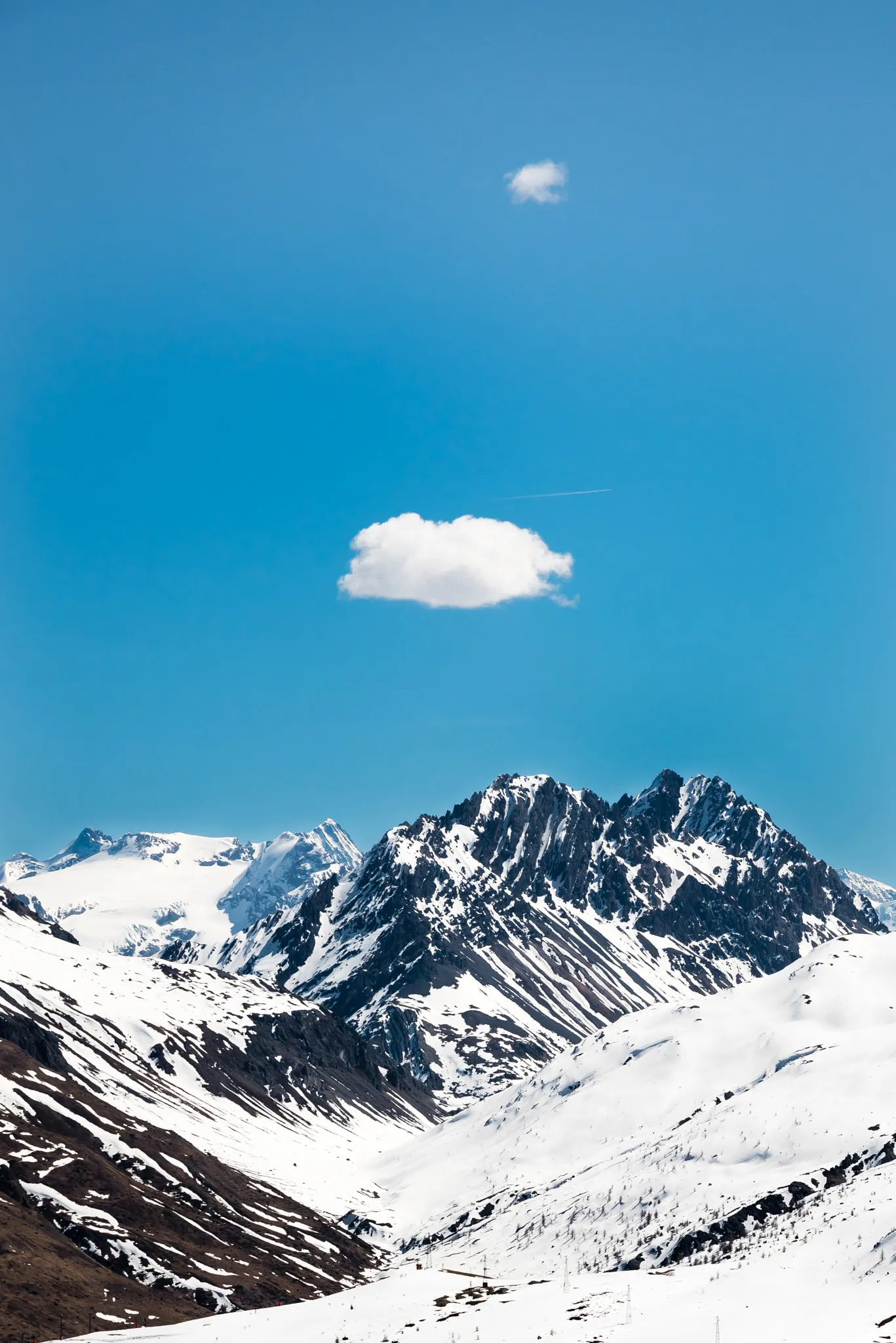 Photo showing: 500px provided description: If you use my image, please drop me a message to make me happy! :-) [#sky ,#clouds ,#italy ,#snow ,#mountain ,#alps ,#Livigno ,#Luca Florio]