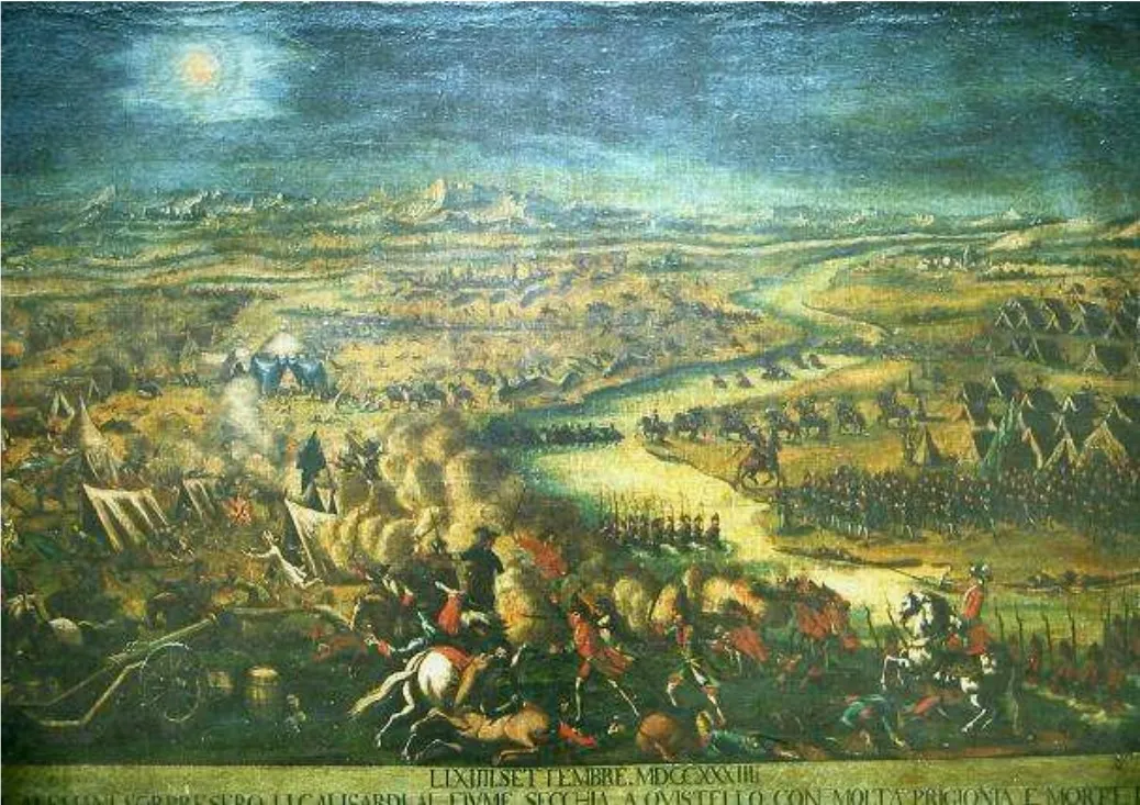 Photo showing: Dipinto raffigurante la battaglia di Quistello del 14 settembre 1734, che vide scontrarsi sulle rive del fiume Secchia l'esercito dei 58.000 Gallo-Sardi comandati da Carlo Emanuele III  contro le forze austriche del conte di Konigseck. Lo scontro si concluse con 3.500 prigionieri, 500 morti e una gran numero di feriti.