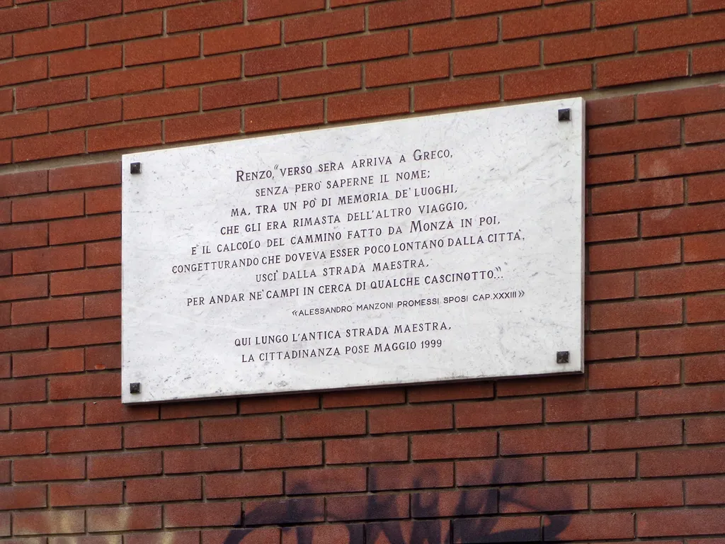 Photo showing: Targa commemorativa di un passo de "I Promessi Sposi" apposta sulla facciata della scuola primaria Gianni Rodari di Milano.