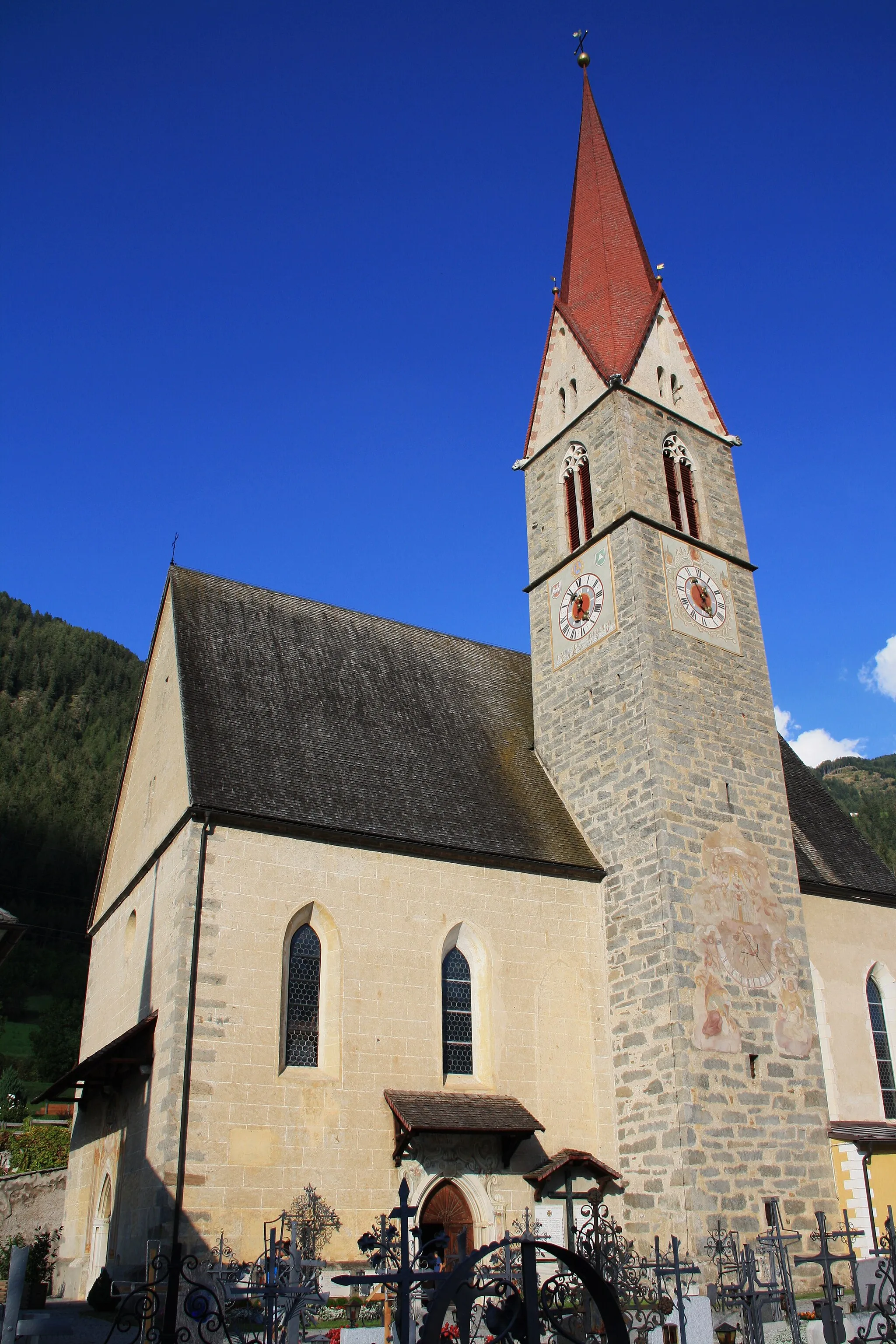 Photo showing: Italy, South Tirol, Freienfeld, Sanctuary Maria Trens. Trens is also a place of pilgrimage, the church is dedicated to the miraculous image of “Our Lady of the Avalanche”, the ancient wooden statue of the “Madonna standing and the Child”, dating back to 1470.  According to a legend a farmer found a wood carved statue among the debris of a landslide and carried it to his house. The following day the statue was founded in a chapel and the people began to venerate it. In a document dated September 10, 1345 it is mentioned for the first time of a church in Trens, in 1407 the family Trauston appointed a weekly Mass to be celebrated on Tuesday in the church. The present church was built in 1498 in Late Gothic with two main entrance; in order to ease the construction the priest of Stilves obtained a “littera indulgentiarum” from twelve cardinals in 1482. The chaplain of the deanery of Trens received in 1648  the commission to say Mass every day in Trens; the pilgrimages to the church increased. The “Chapel of Our Lady” was inaugurated on March 29, 1728 and take place on the left side of the nave with the wall covered by the numerous votive offering. At the half of 18th century the church underwent to a restoration in Baroque on project by Joseph Adam Ritter von Mölk. The miraculous image was crowned in 1928 and the church became parish in 1939. The façade of the Sanctuary „Maria Trens“.