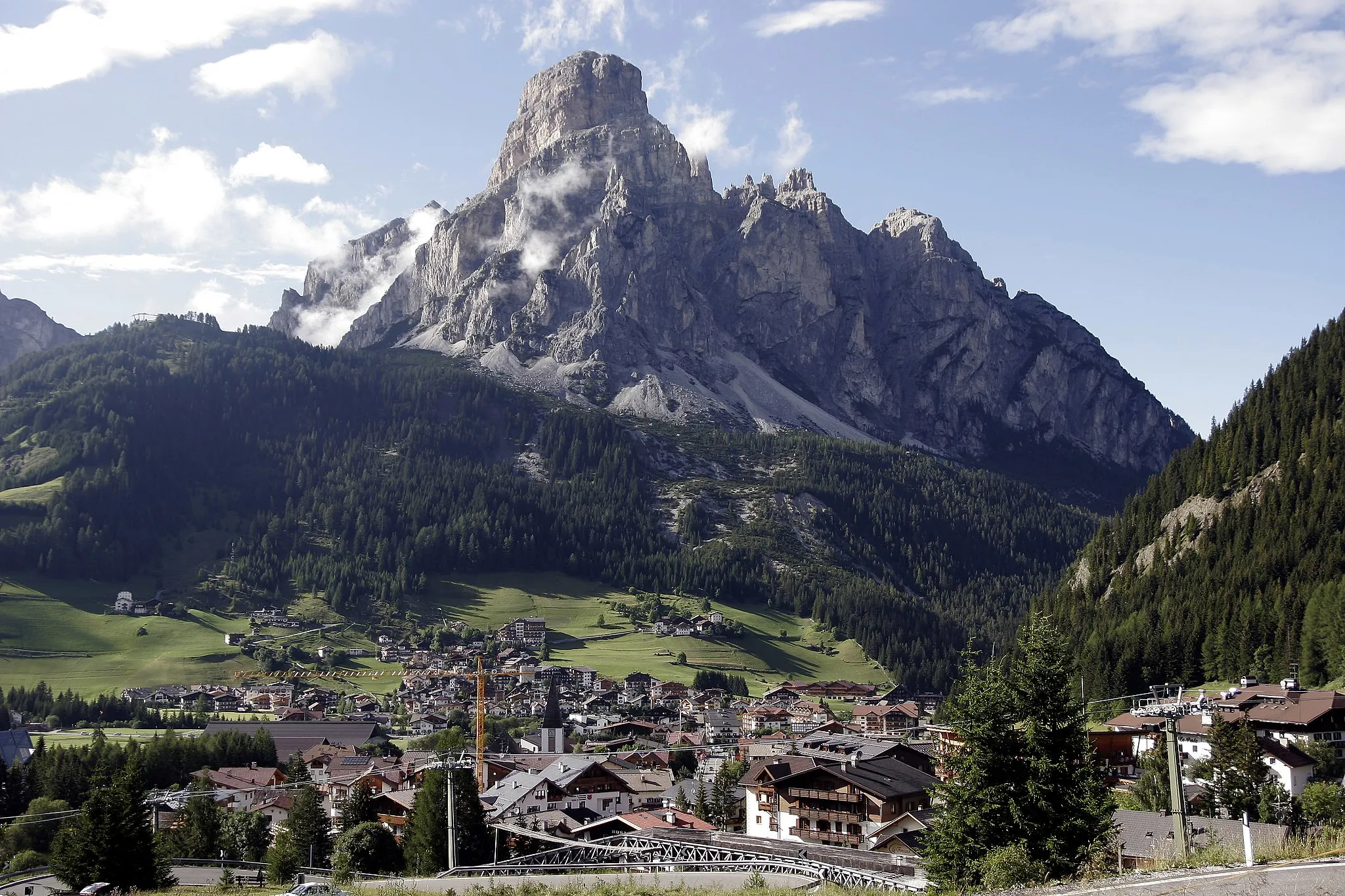 Photo showing: Corvara, with the Sassongher mountain (2665 m) in the background. Picture taken from the road to passo Campolongo.