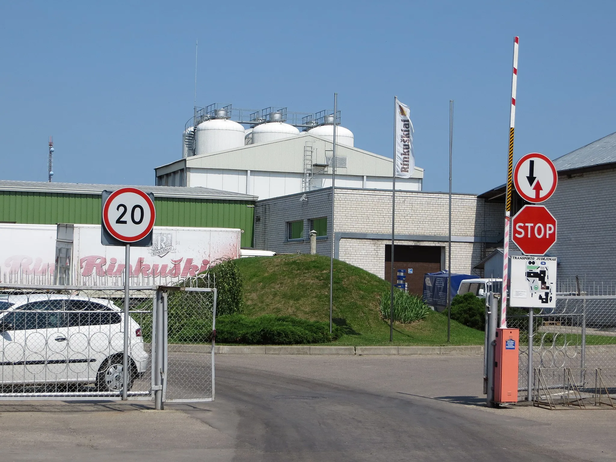 Photo showing: Looking in through the gates at Rinkuškiai brewery established in 1991 just outside Biržai, Lithuania.