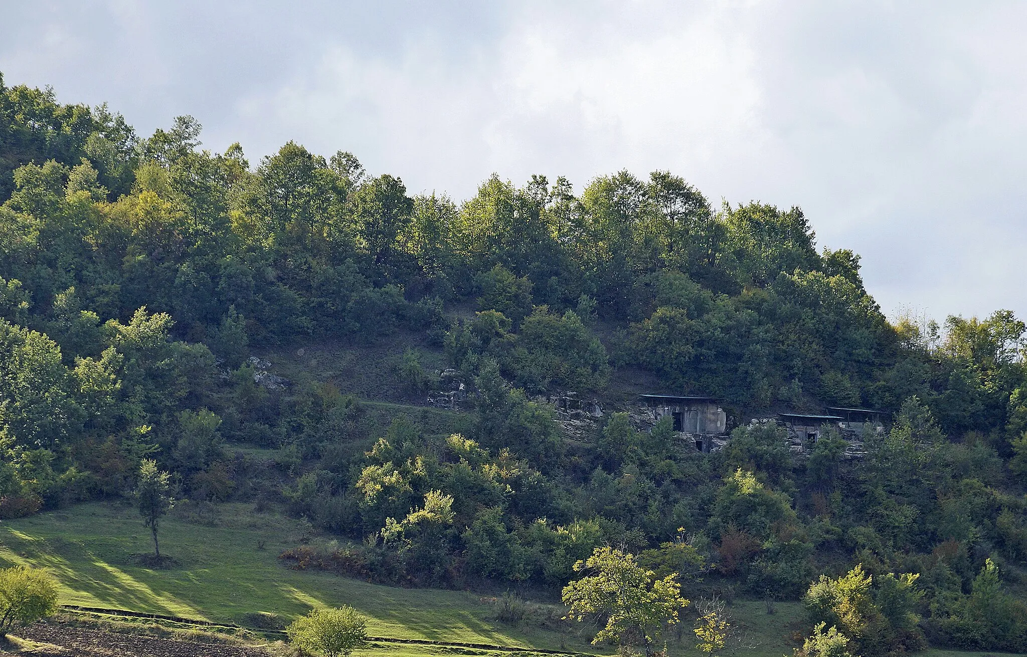 Photo showing: Selca e Poshtmë, Albania: Graves 1 to 3 on the hill seen from the village