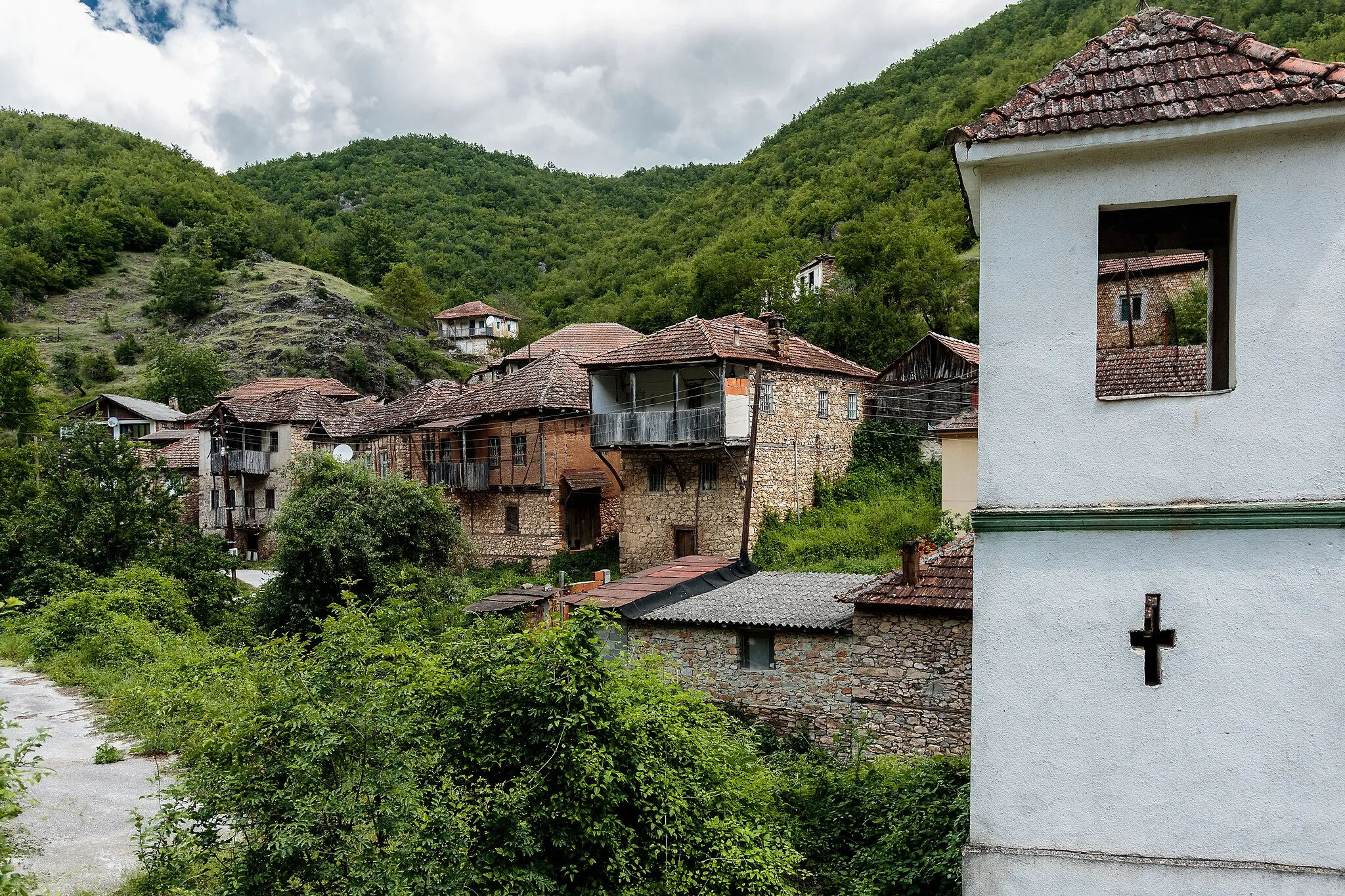 Photo showing: Bell tower and old houses in the village Železnec