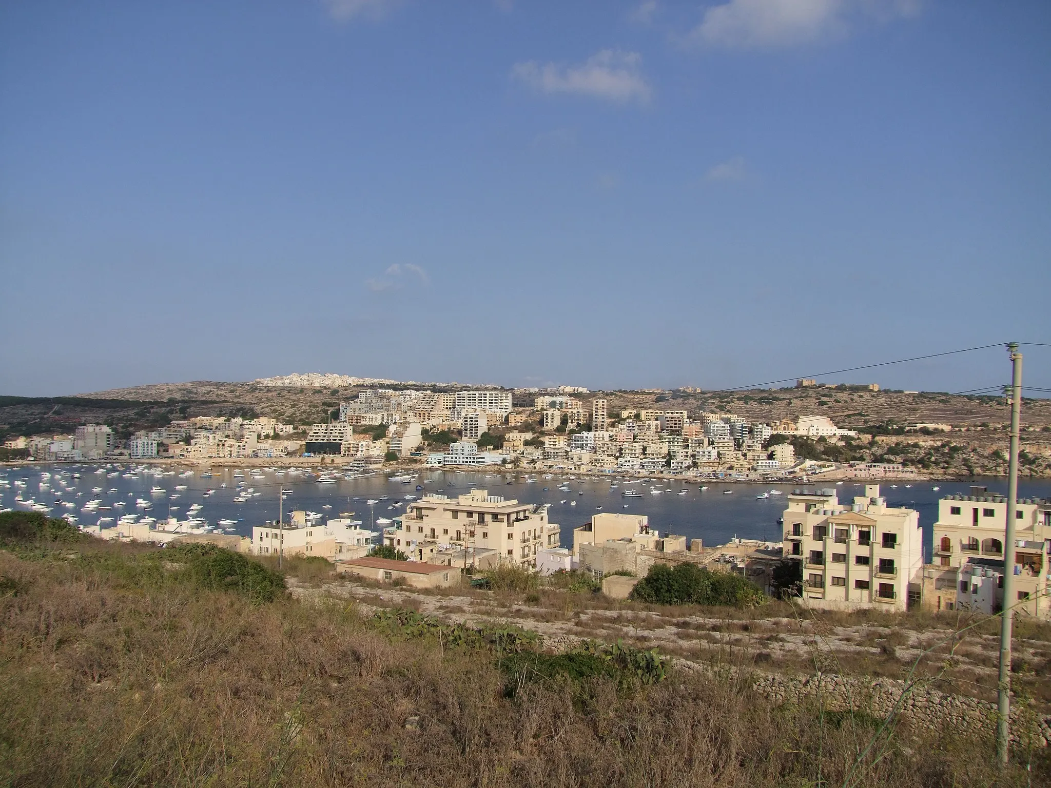 Photo showing: View over the Bay of St. Paul's Bay and Xemxija to Mellieħa early in the morning