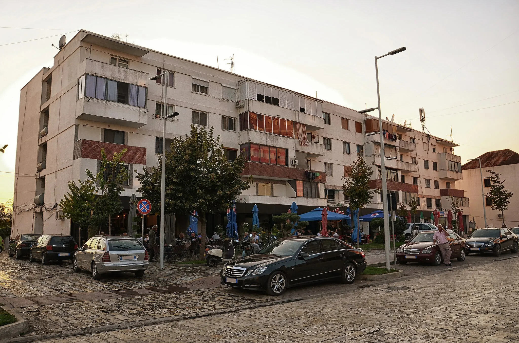 Photo showing: The main street of Koplik, Albania, with apartment buildings