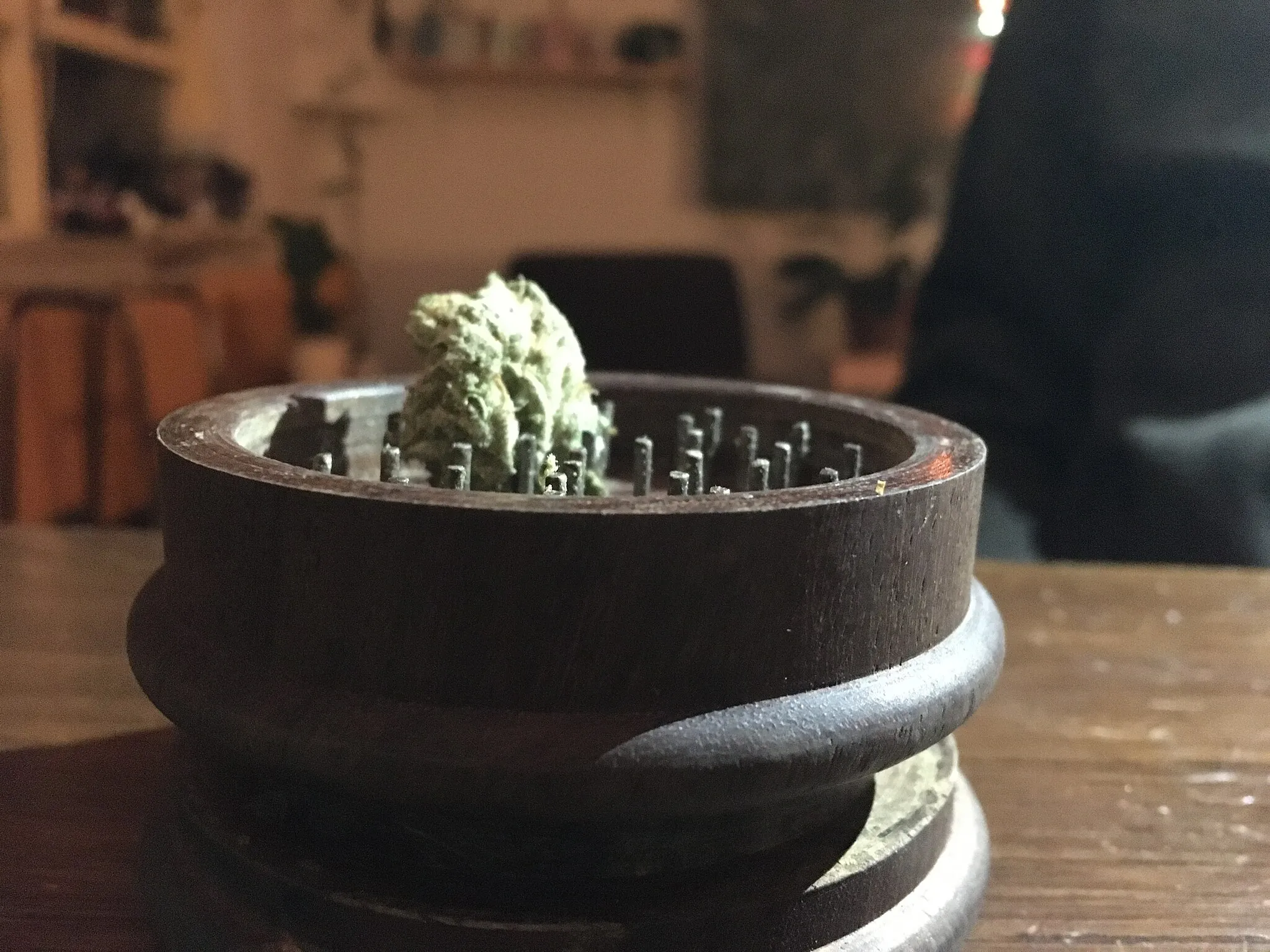 Photo showing: A wooden grinder with 0.4 grams of amnesia haze