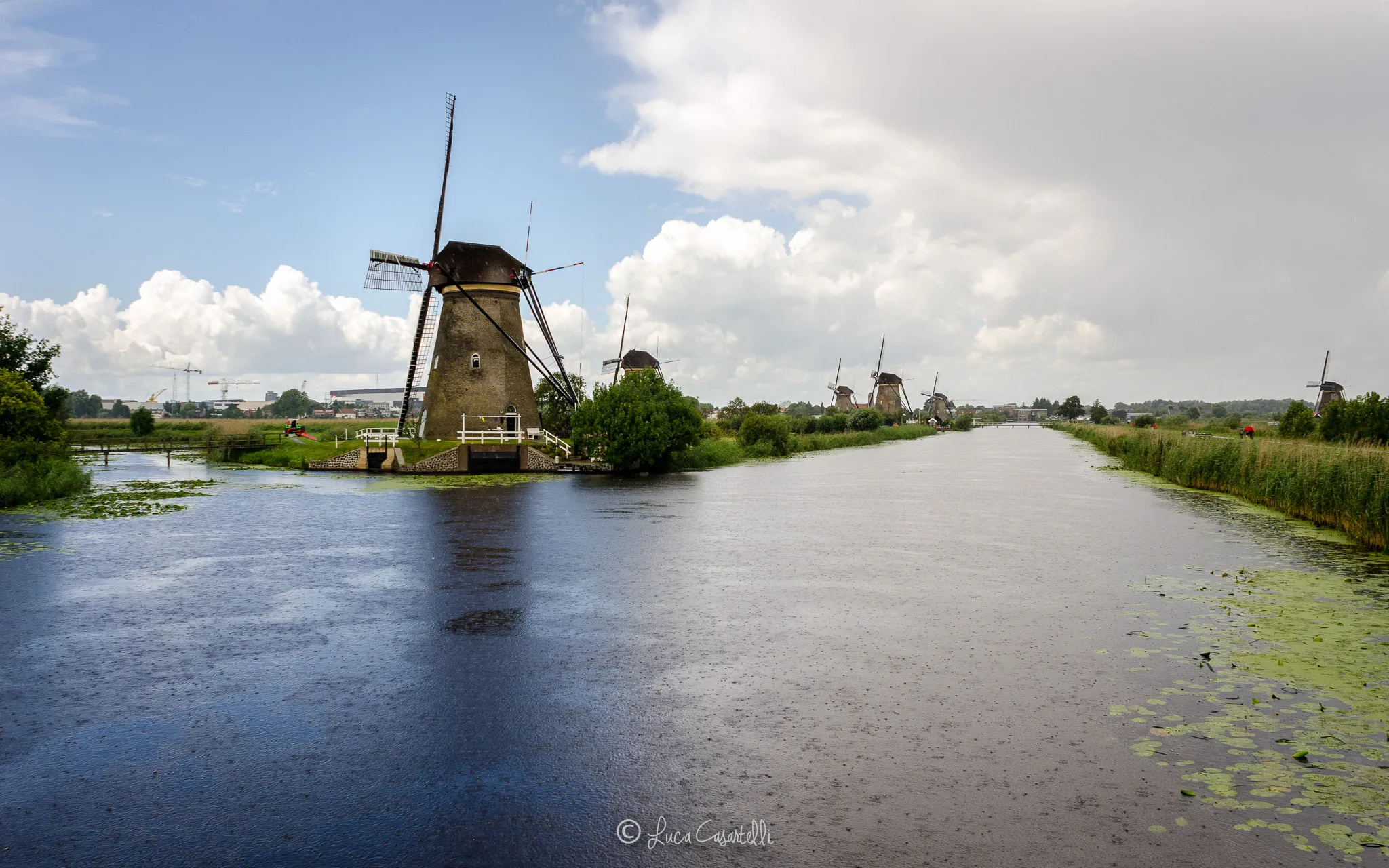 Photo showing: 500px provided description: Kinderdijk [#clouds ,#storm ,#canal ,#trip ,#windmills ,#Netherlands ,#Kinderdijk]
