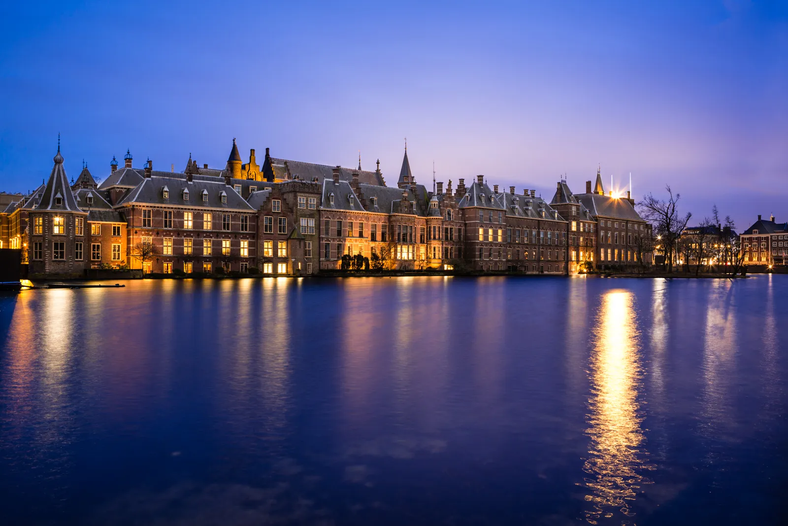 Photo showing: It's been very cloudy today, but luckily the sky tends to color very nicely at this time of day. Enjoy!
The Binnenhof (Dutch, literally "inner court"), is a complex of buildings in The Hague. It has been the location of meetings of the Staten-Generaal, the Dutch parliament, since 1446, and has been the center of Dutch politics for many centuries.
(Source: Wikipedia)

Absolutely best on black.