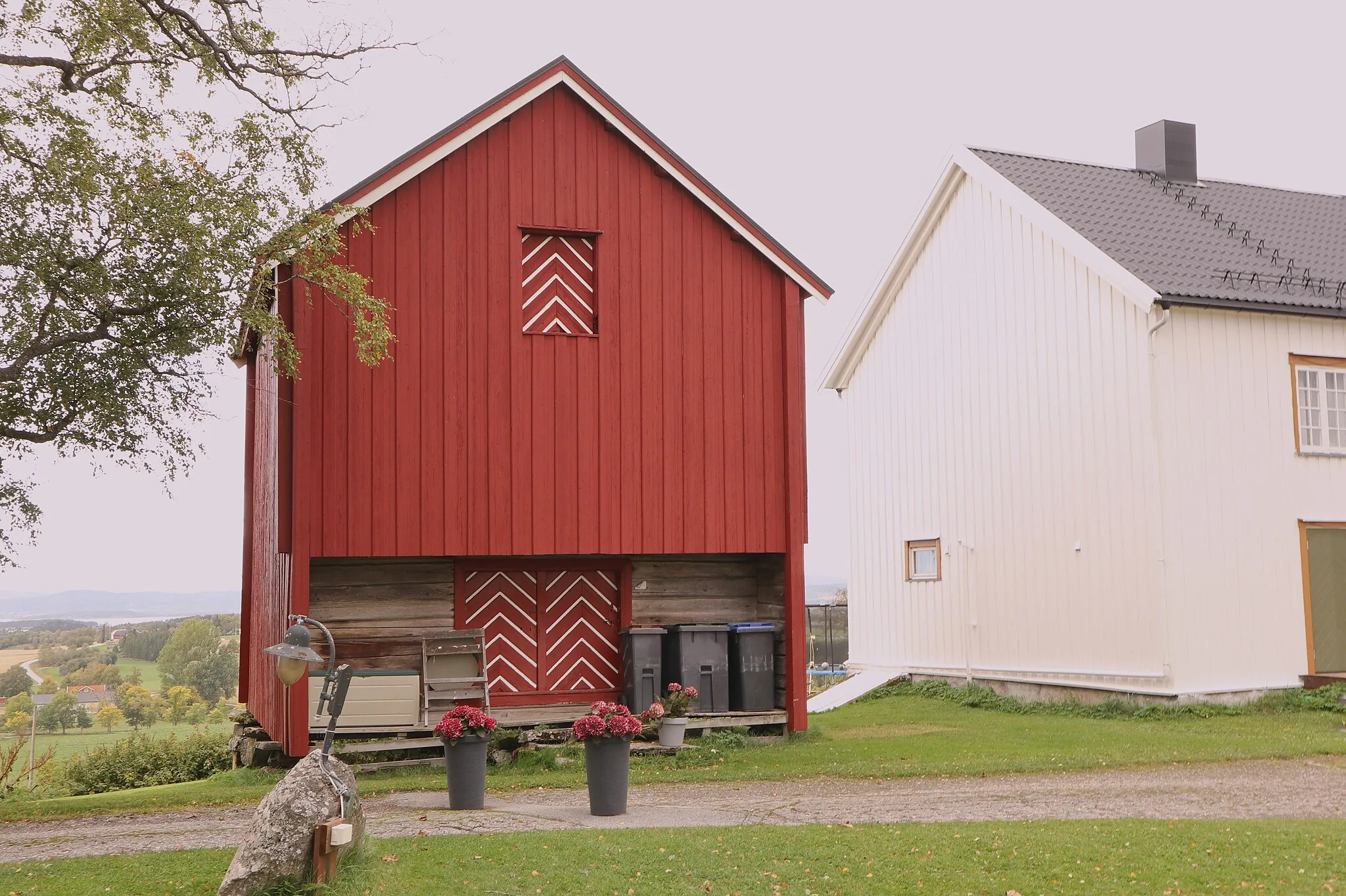 Photo showing: Farm houses on a hill.