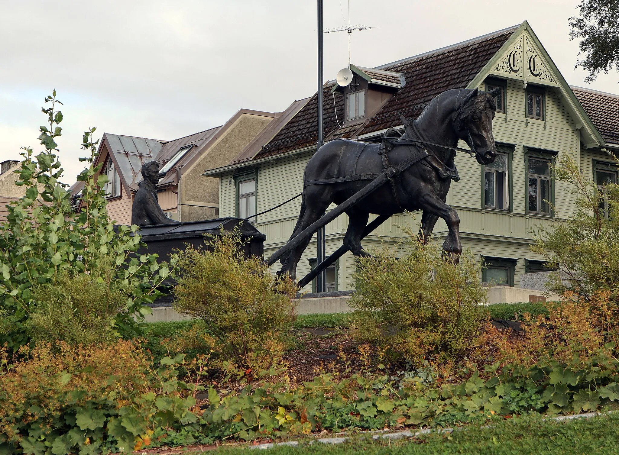 Photo showing: Green area, houses in background