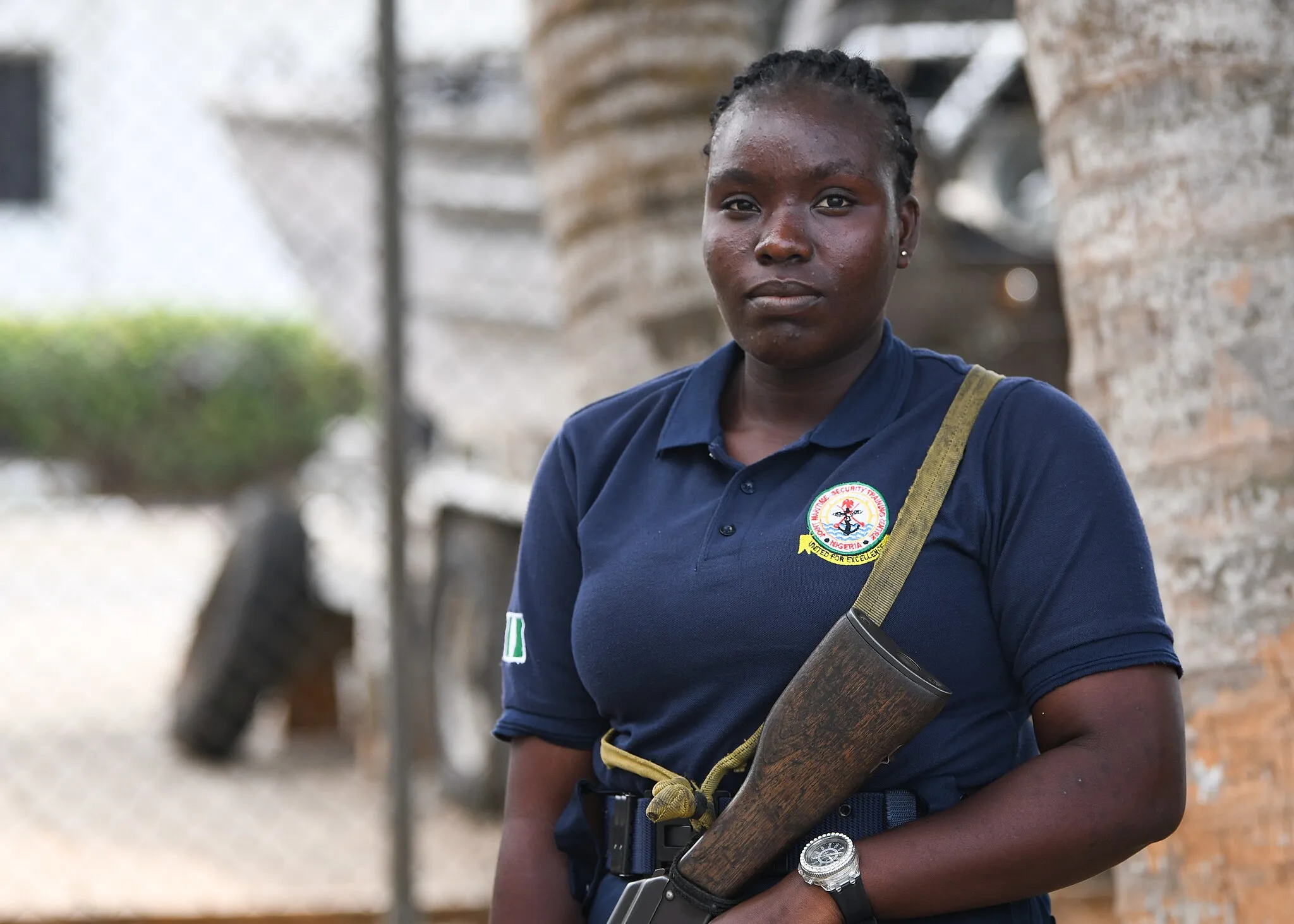 Photo showing: 230125-N-DK722-1022 (Jan. 25, 2023) LAGOS, Nigeria – Nigerian Navy Ordinary Seaman Hana Pearce Oluwatosin, a sentry, poses for a photo in Lagos, Nigeria, Jan. 25, 2023 during exercise Obangame Express 2023. Obangame Express 2023, conducted by U.S. Naval Forces Africa, is a maritime exercise designed to improve cooperation, and increase maritime safety and security among participating nations in the Gulf of Guinea and Southern Atlantic Ocean. U.S. Sixth Fleet, headquartered in Naples, Italy, conducts the full spectrum of joint and naval operations, often in concert with allied and interagency partners, in order to advance U.S. national interests and security and stability in Europe and Africa. (U.S. Navy photo by Mass Communication Specialist 1st class Cameron C. Edy)