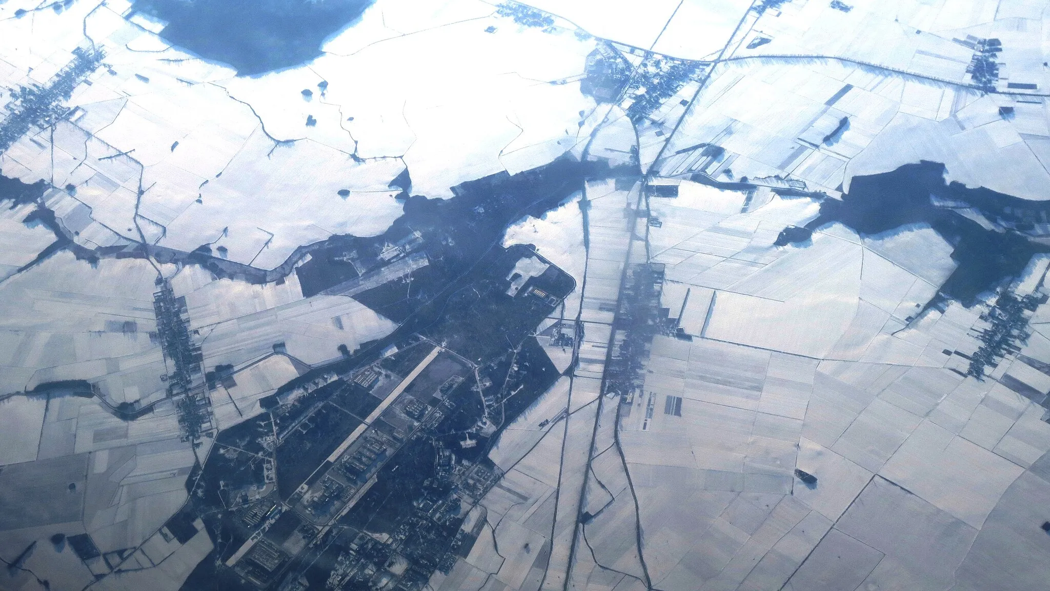 Photo showing: Aerial view of a part of the settlement Skarbimierz, outside Brzeg city,. We see much of the Skarbimierz Industrial Park from northeast towards Southwest. Poland.