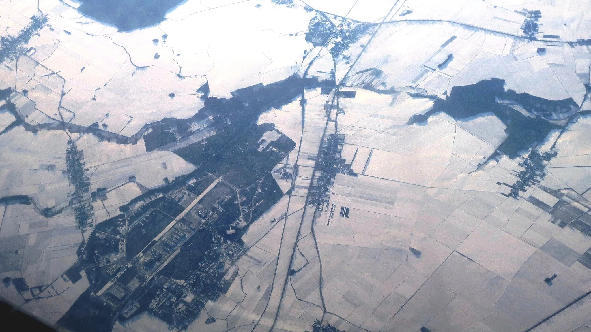 Photo showing: Aerial view of a part of the settlement Skarbimierz, outside Brzeg city,. We see much of the Skarbimierz Industrial Park from northeast towards Southwest. Poland.