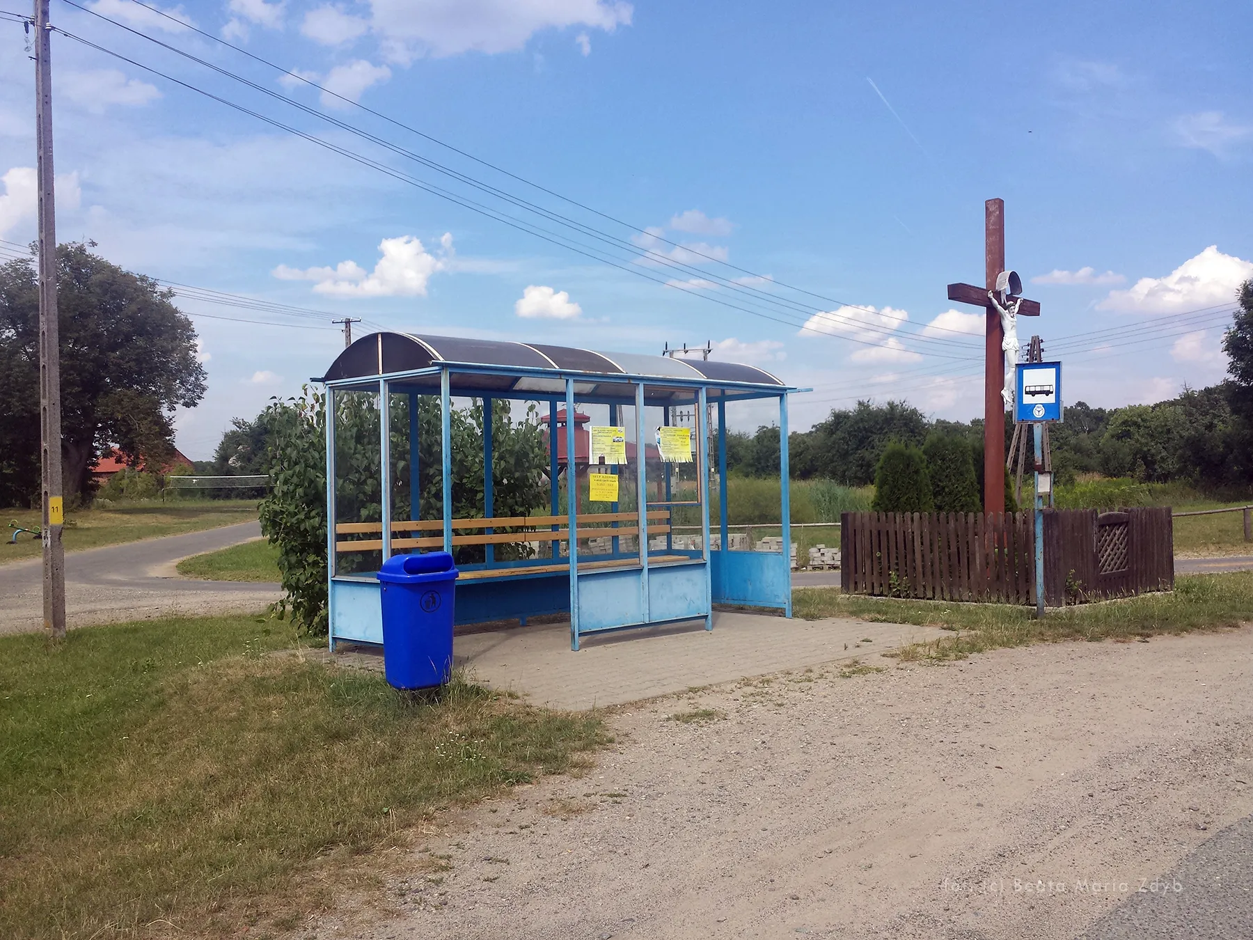 Photo showing: Bus station and wayside cross