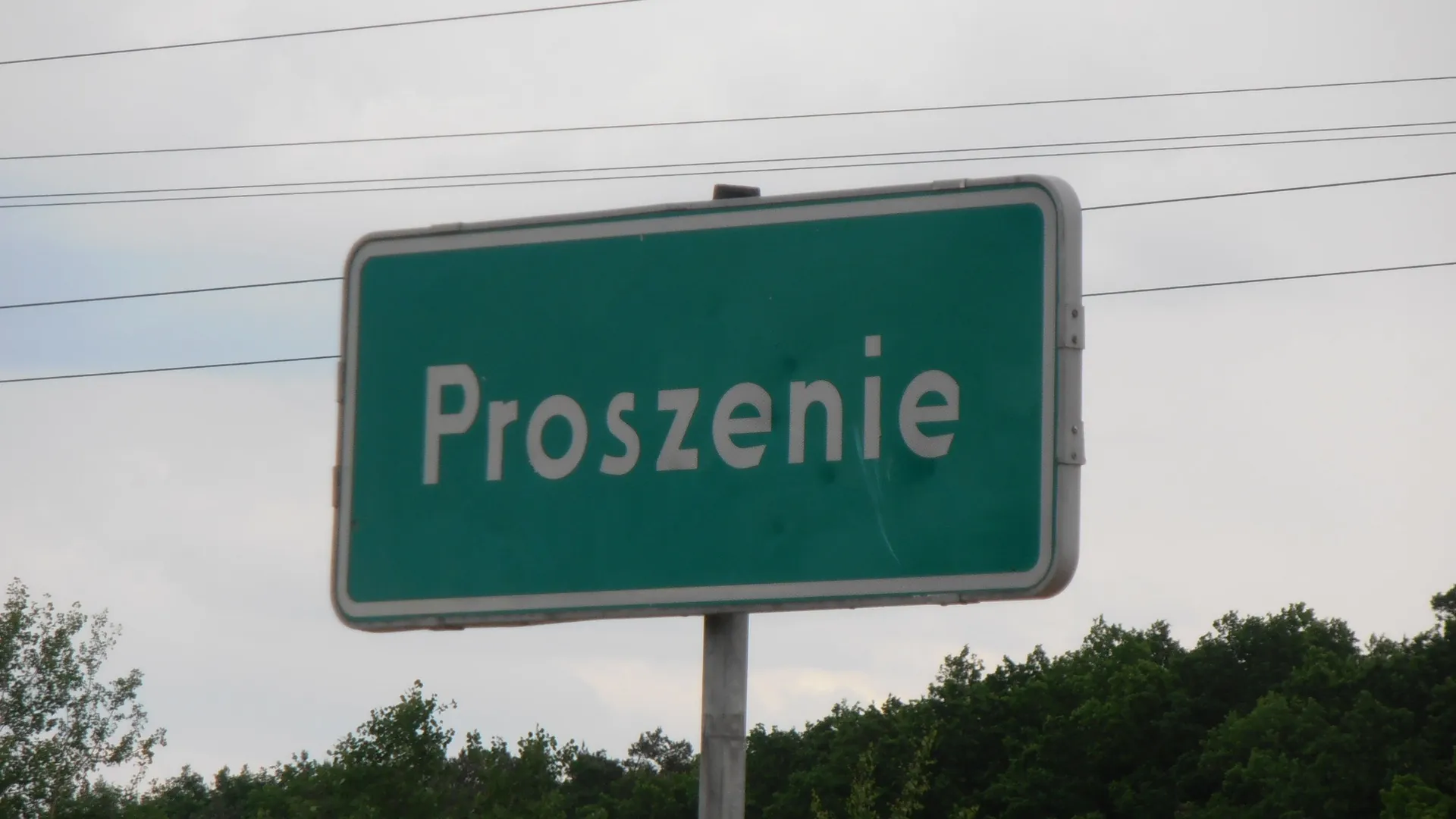 Photo showing: Proszenie (pow. piotrkowski, woj. łódzkie). Tablica z nazwą miejscowości.
