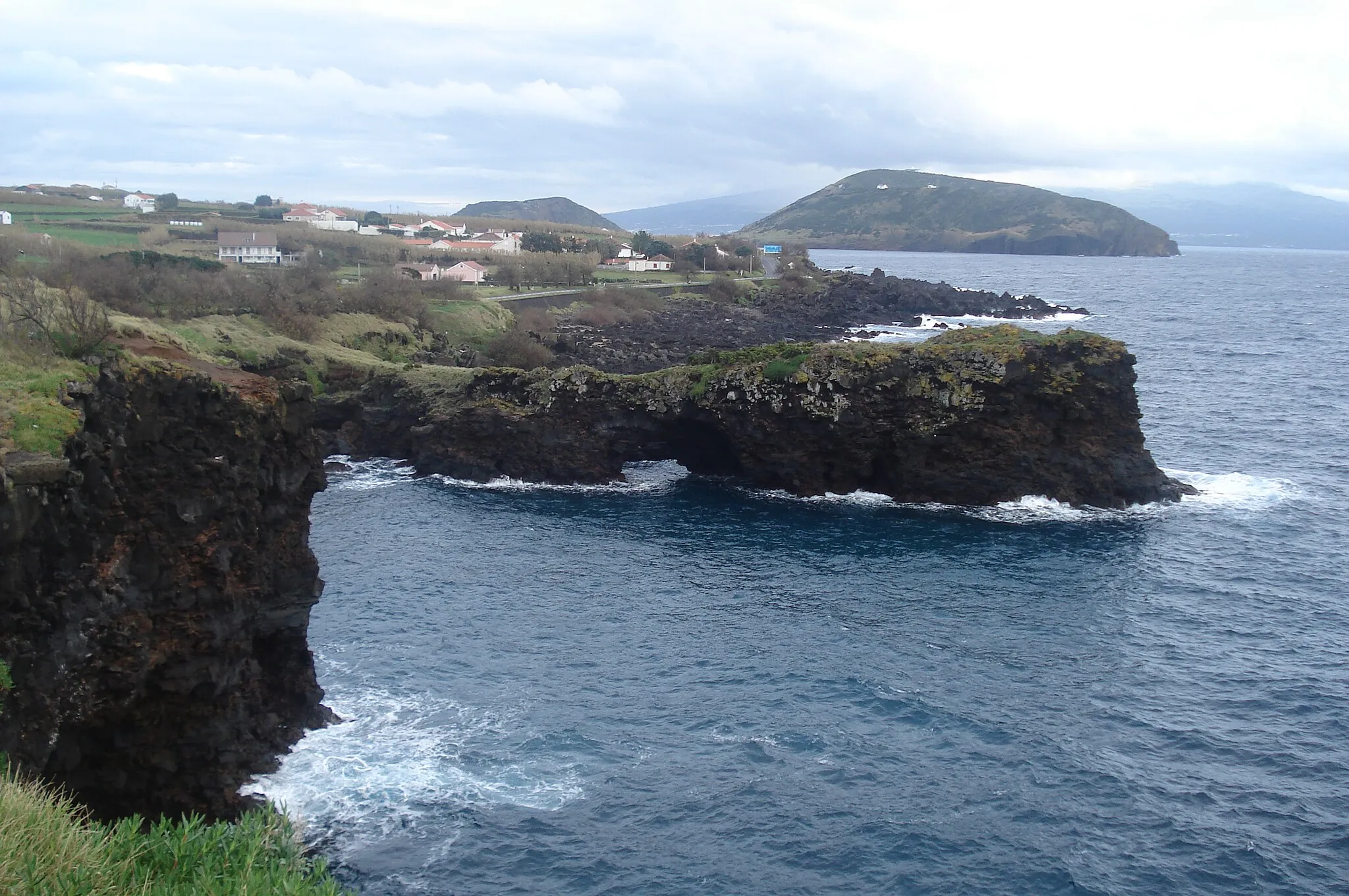 Photo showing: The southern coast of Feteira, with Pico Island in the distance, Horta, Faial Island, Azores