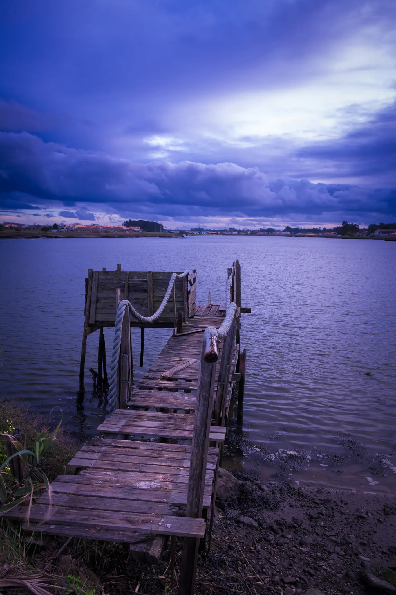 Photo showing: 500px provided description: The Day After [#sky ,#lake ,#sunset ,#water ,#river ,#blue ,#clouds ,#jetty]