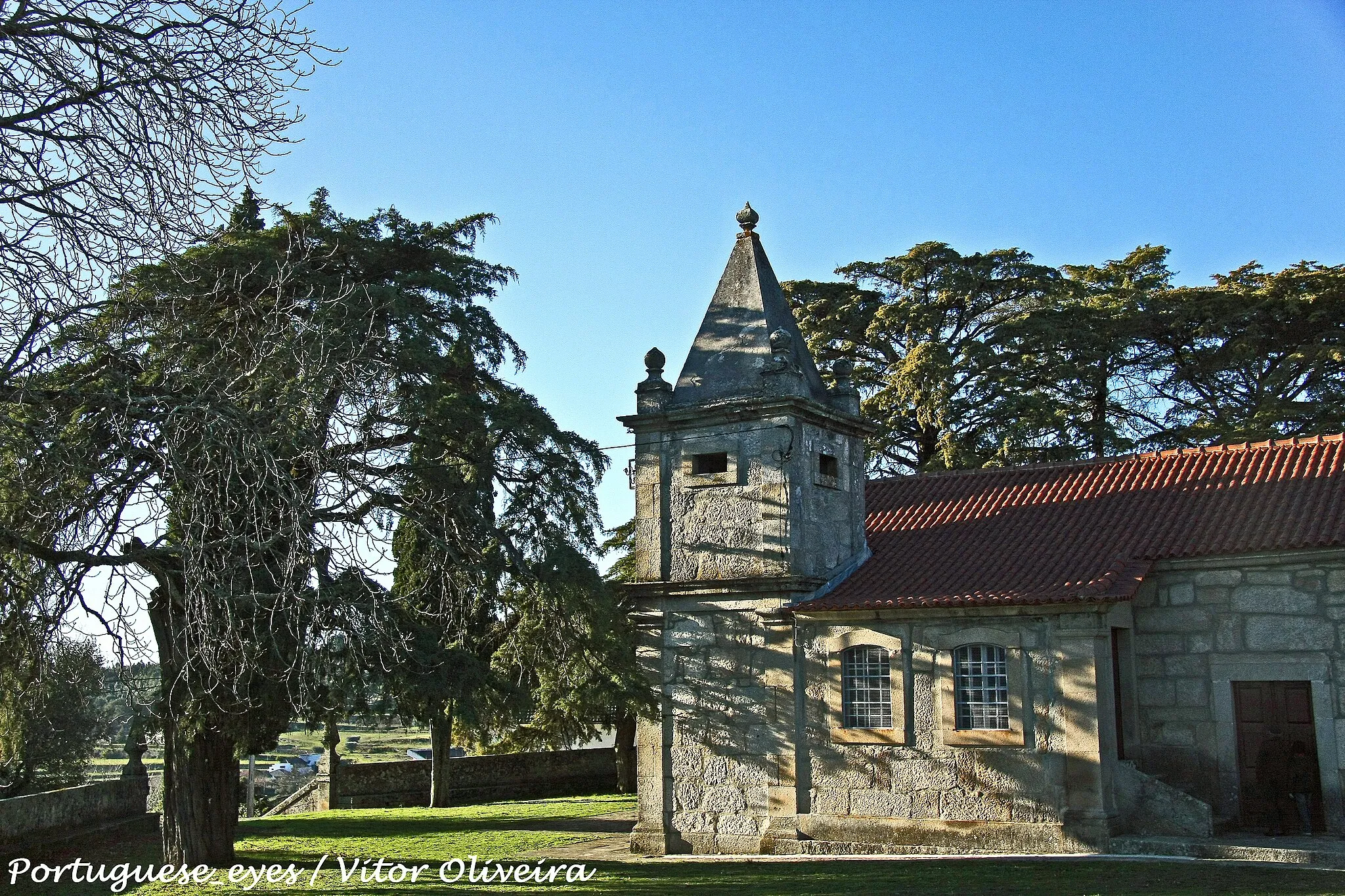 Photo showing: A capela de Nossa Senhora de Cervães é um dos mais belos santuários do conselho de Mangualde, quer pela construção em si, quer pelo espaço envolvente constituído por um amplo adro murado, frondosamente coberto por copas de árvores seculares. É uma construção granítica datada do século XII, sendo a data de edificação apontada por vários escritos de 1660.
Dedicada à Nossa Senhora de Cervães, a sua história não é muito clara e poderá em parte ter-se perdido de geração em geração.
No entanto, escritos do Dr. Valentim da Silva (citando Frei Agostinho de Santa Maria) apontam neste sentido:
Entre Santiago de Cassurrães e Póvoa de Cervães, existe um sítio denominado Cervas ou Cervães. Naquele vale, um homem terá sido atacado por muitos veados e, já prestes a morrer, rezou à Virgem para que o socorresse. Os veados desapareceram e assim se terá operado o milagre que deu origem ao nome de “Nossa Senhora de Cervães”. Ali naquele local, ter-se-á construído então a primitiva capela, que por ser um local ermo e desabitado, seria transferida em 1660 para o local onde hoje se encontra.
A festa em honra e louvor de Nossa Senhora de Cervães celebra-se anualmente no segundo domingo do mês de Setembro, ou seja, no domingo seguinte à romaria de Nossa Senhora do Castelo em Mangualde que se celebra a 8 de Setembro. Nesse dia a missa campal que se realiza no adro é precedida de concorrida procissão, desde a Igreja Paroquial em Santiago, onde para além das irmandades, banda filarmónica e demais povo marcam presença tractores finamente engalanados transportando os santos padroeiros das restantes capelas das 9 aldeias que constituem a freguesia de Santiago de Cassurrães, fechando o cortejo a própria Senhora de Cervães.
O conjunto arquitectónico, é complementado ainda por uma fonte e pela capelinha do calvário, ambas situadas na parte posterior do Santuário, e por uma frondosa escadaria em granito mesmo em frente ao santuário e que dá acesso ao adro.
Este é um lugar tranquilo e óptimo para passar uma tarde em família. Vem até à freguesia de Santiago de Cassurrães em Mangualde e respira um pouco de paz neste santuário que é Monumento Nacional desde 1986.
EN:
One of the most beautiful sanctuaries in Mangualde is the chapel of “Nossa Senhora de Cervães”, either because of the construction itself or by the involving churchyard surrounded by huge secular trees. It’s a stone construction from the XII century. Some authors point the year of 1660 us the date of construction. The chapel is dedicated to Nossa Senhora de Cervães and its history is not very clear, and probably it was lost among generations.
However, notes of Dr. Valentim Da Silva (citing Frei Agostinho de Santa Maria) point in this direction:
Between Santiago de Cassurrães and Póvoa de Cervães, exists a little place called Cervas or Cervães. In that valley, a man has been attacked for many Deer’s, so he prayed to the Virgin to save him from a certain death. The Deer’s disappeared and this “miracle” gave origin to the name of "Nossa Senhora de Cervães”. In that place was constructed the primitive chapel, given that it was a very lonely and uninhabited place, the chapel was transferred to the actual place by the year 1660.

Nossa Senhora de Cervães is annually celebrated in the second Sunday of September. On that day the Mass takes place on the churchyard, but before that there is a procession, which begins at the parochial church at Santiago to the Chapel of Nossa Senhora de Cervães.

The procession is formed not only by the brotherhood, the people and the philharmonic orchestra, but also by tractors very beautifully ornamented, which finality is the transport of the patron saints from the other nine villages, that all together make the parish of Santiago. The procession is closed by Nossa Senhora de Cervães.

The architectural set is complemented by a deactivated fountain and a little chapel called “O Calvário”, both situated behind the Sanctuary, and for a granite stairs in front that gives access to the churchyard.
This is an excellent and quiet place for spent some time with family and friends. Make a journey to Santiago de Cassurrães, near Mangualde, and feel the peace on this Sanctuary, classified as National Monument since 1986. www.geocaching.com/seek/cache_details.aspx?wp=GC12D5F

See where this picture was taken. [?]