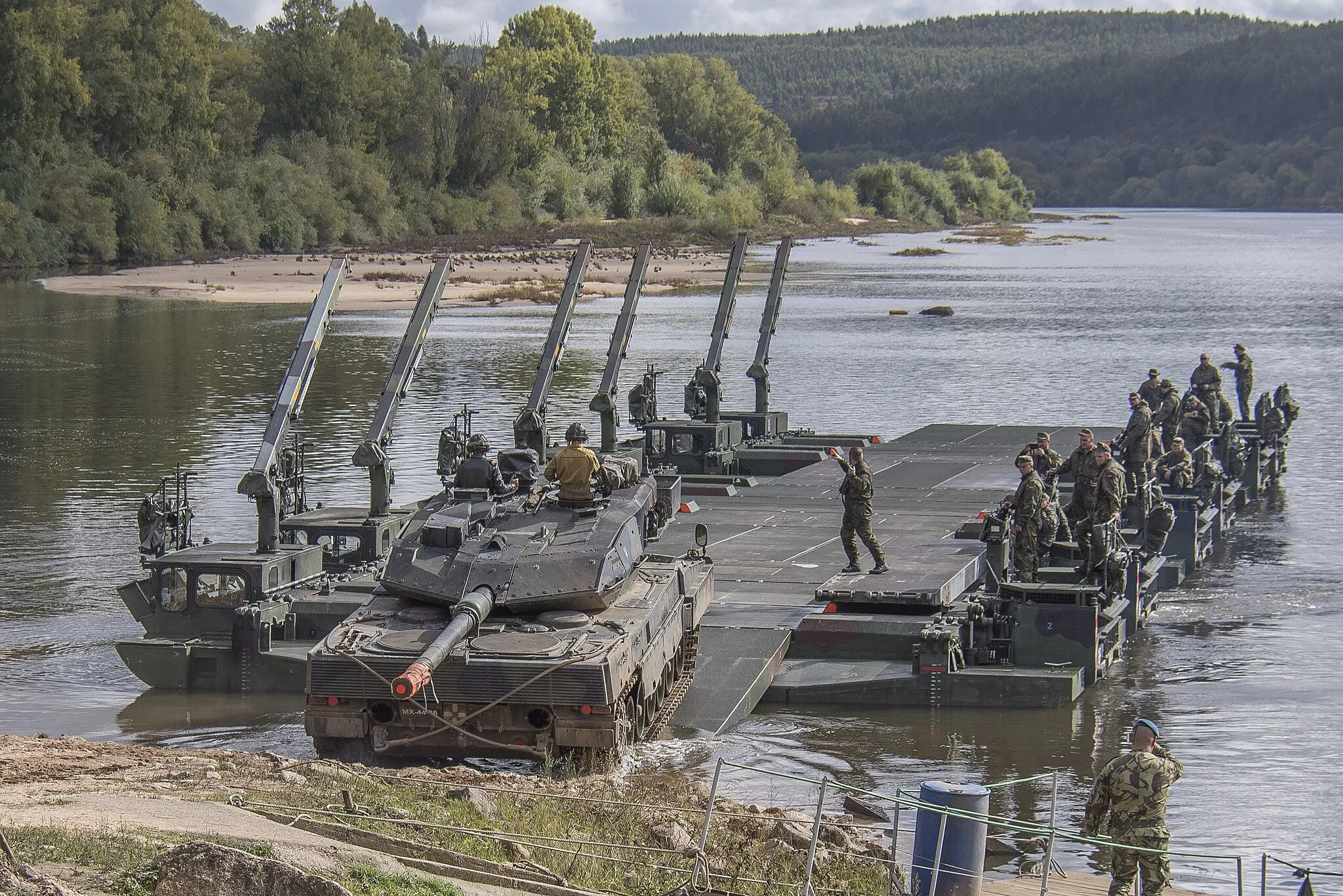 Photo showing: Portuguese tank embarks on a german amphibious bridge in Santa Margarida, Portugal, during JOINTEX 15 as part of NATO’s exercise TRIDENT JUNCTURE 15 on October 27, 2015 .
.
Photo: Sgt Sebastien Frechette, PA Technician.

VL06-2015-378-27