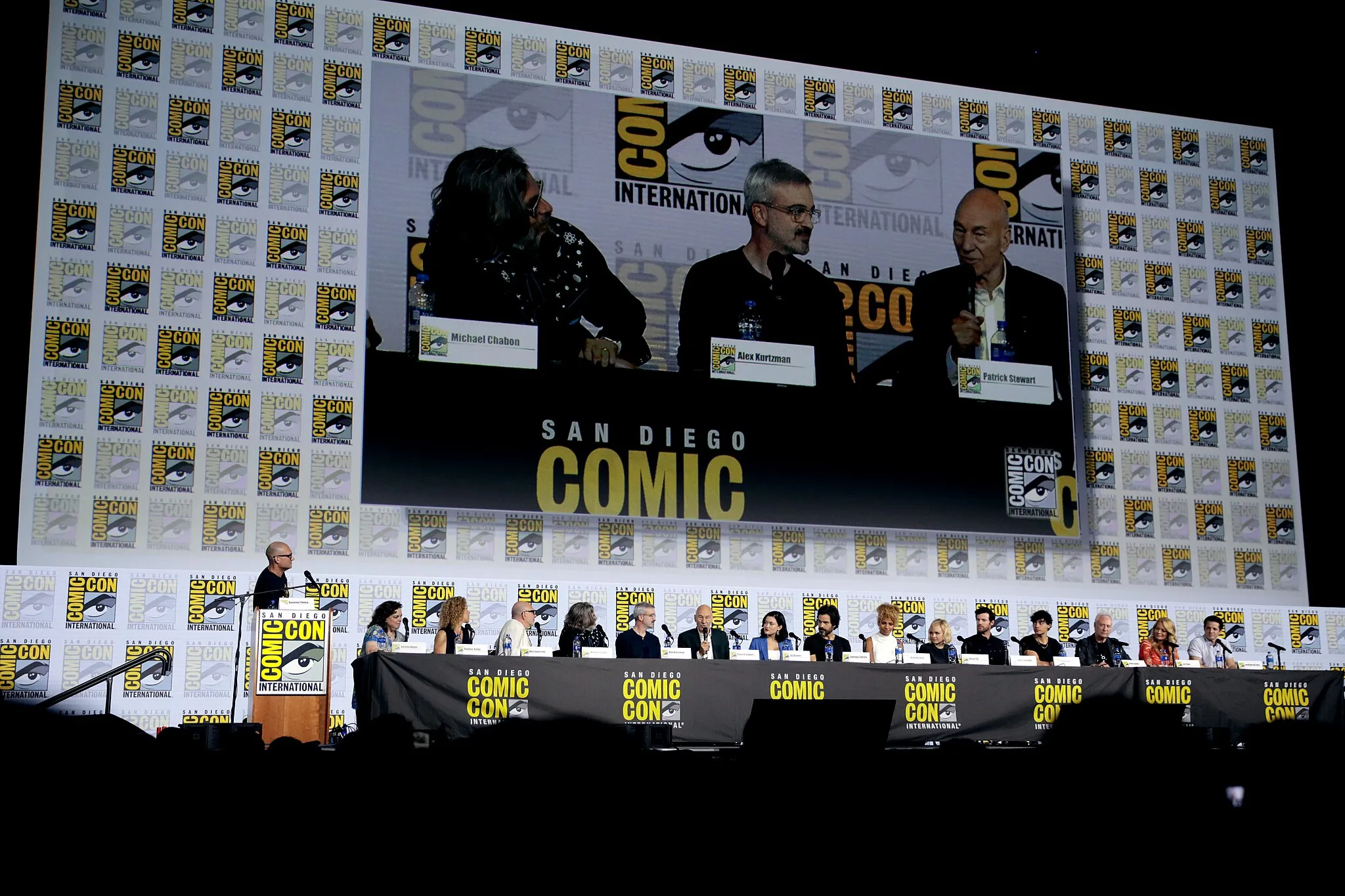 Photo showing: Dominic Patten, Kirsten Beyer, Heather Kadin, Akiva Goldsman, Michael Chabon, Alex Kurtzman, Patrick Stewart, Isa Briones, Santiago Cabrera, Michelle Hurd, Alison Pill, Harry Treadaway, Evan Evagora, Brent Spiner, Jeri Ryan and Jonathan Del Arco speaking at the 2019 San Diego Comic Con International, for "Star Trek: Picard", at the San Diego Convention Center in San Diego, California.

Please attribute to Gage Skidmore if used elsewhere.