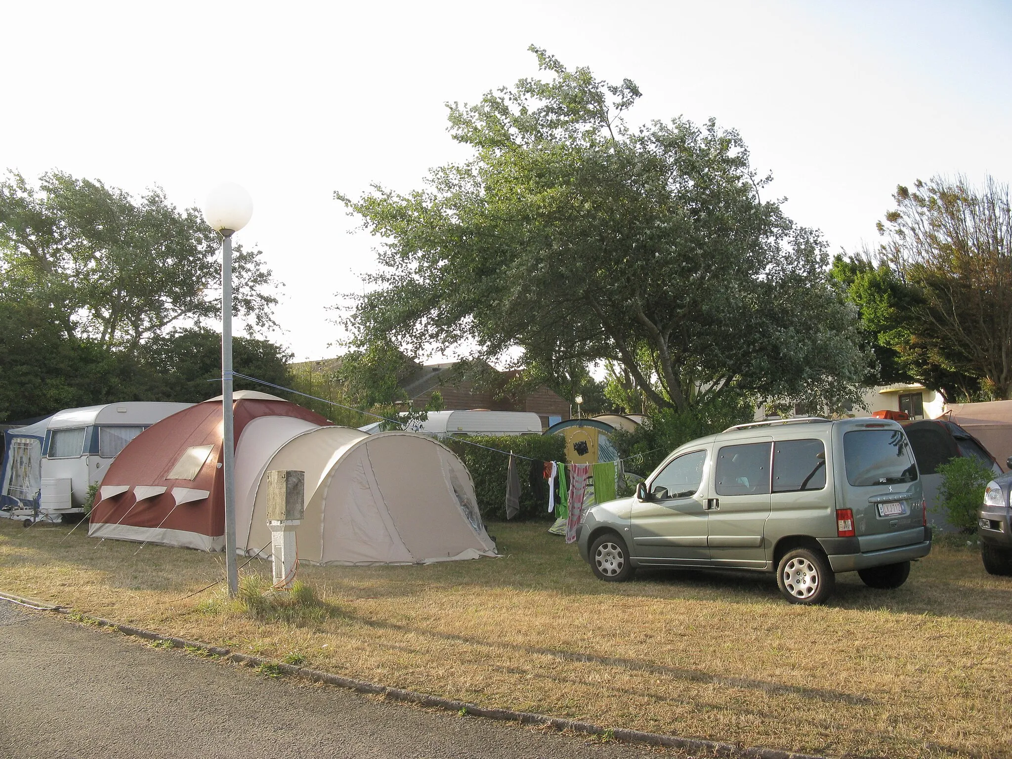 Photo showing: Closed tent and Peugeot Partner at dawn at Saint-Marc-sur-Mer camping site.