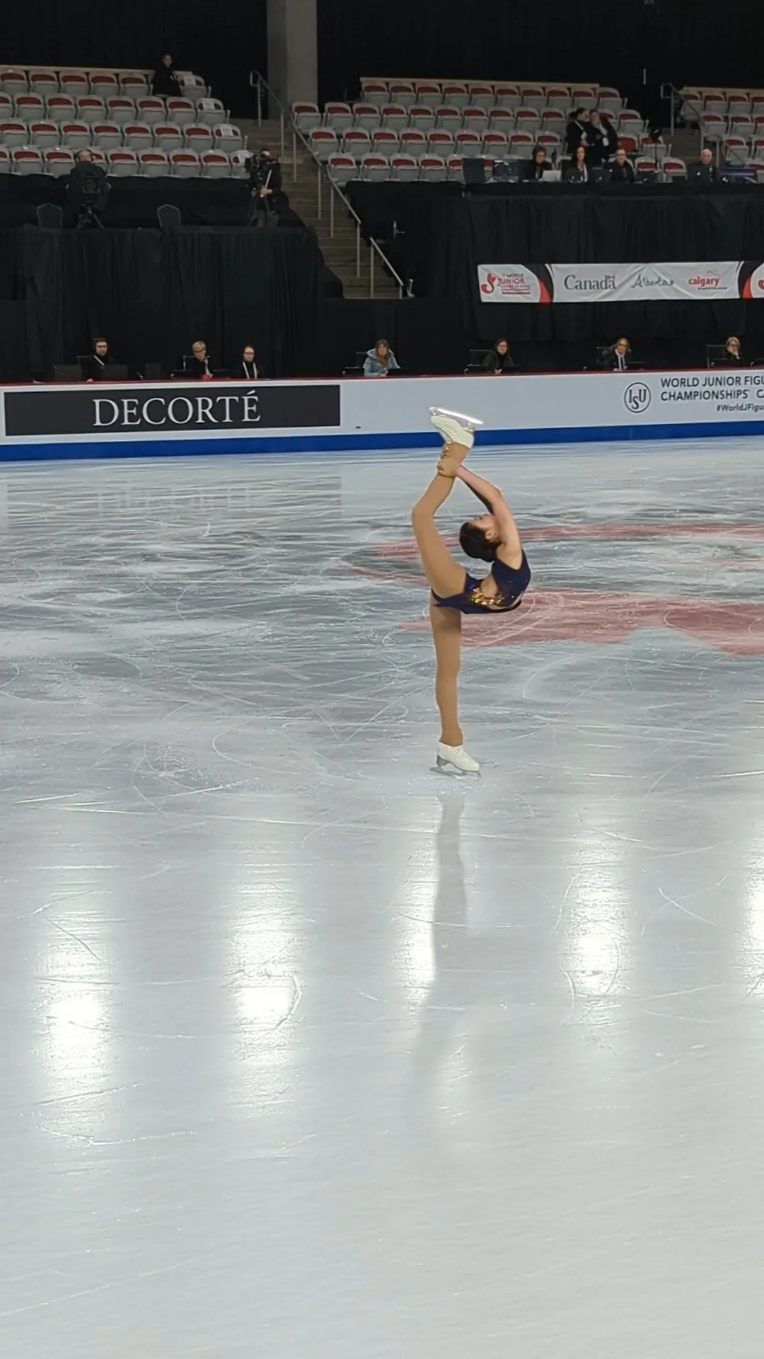 Photo showing: An Xiangyi performing a hyperextended Biellmann spin at the Junior World Championships 2023 in her Free Skate