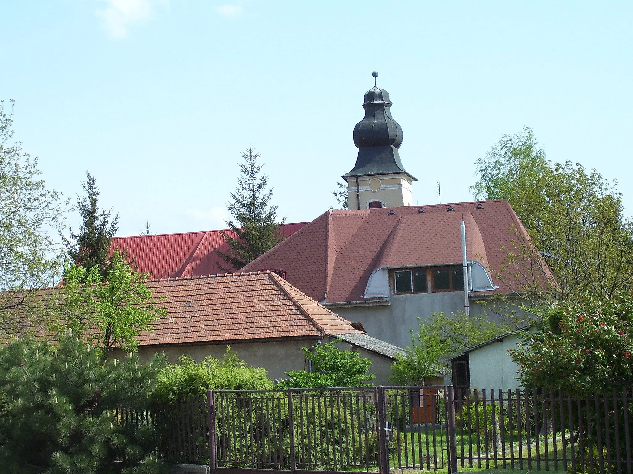 Photo showing: The photo was taken in Jelenec (Hungarian: Gímes) village in Slovakia on 2 May 2008. The steeple can be seen in the background.