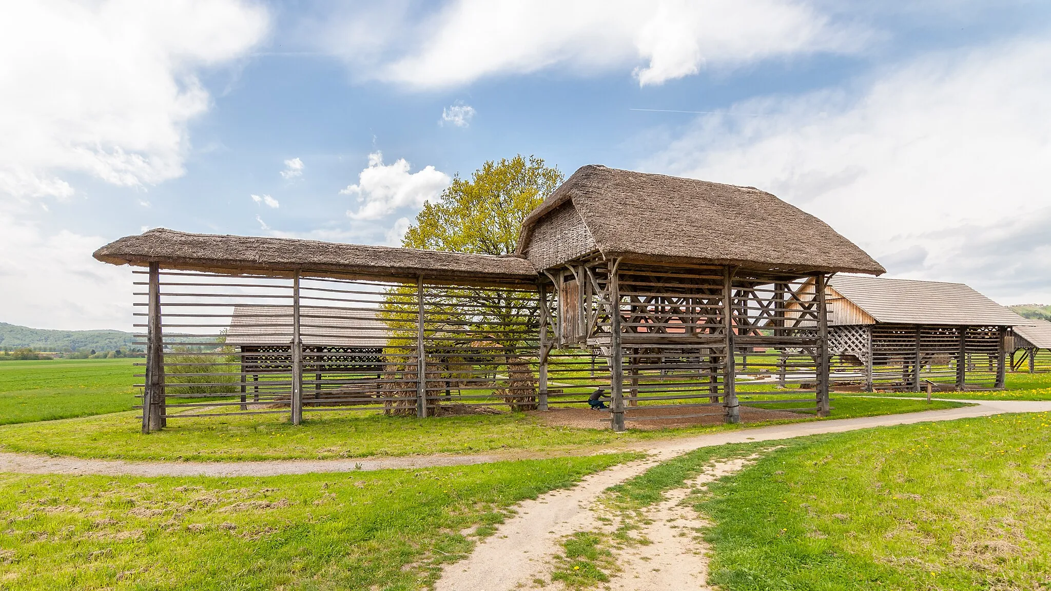 Photo showing: Roofed double hayrack with extension in open air museum "Land of Hayracks" in Šentrupert, Slovenia
