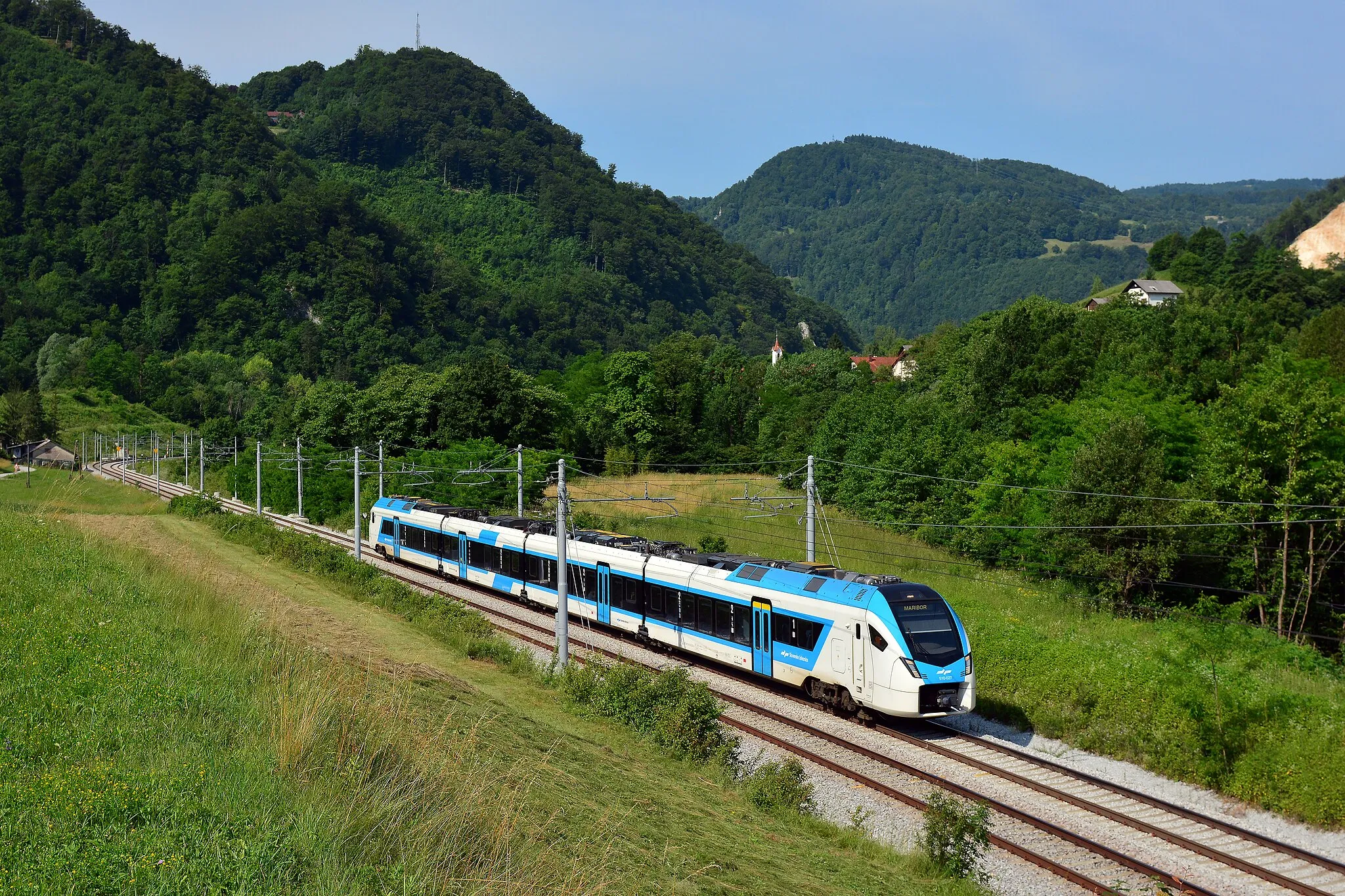 Photo showing: 510 027 (Stadler rail FLIRT 4 type EMU) shortly after passing Zidani Most junction, and working on a passenger service to Maribor.

photrain.net/photos/photo/15670