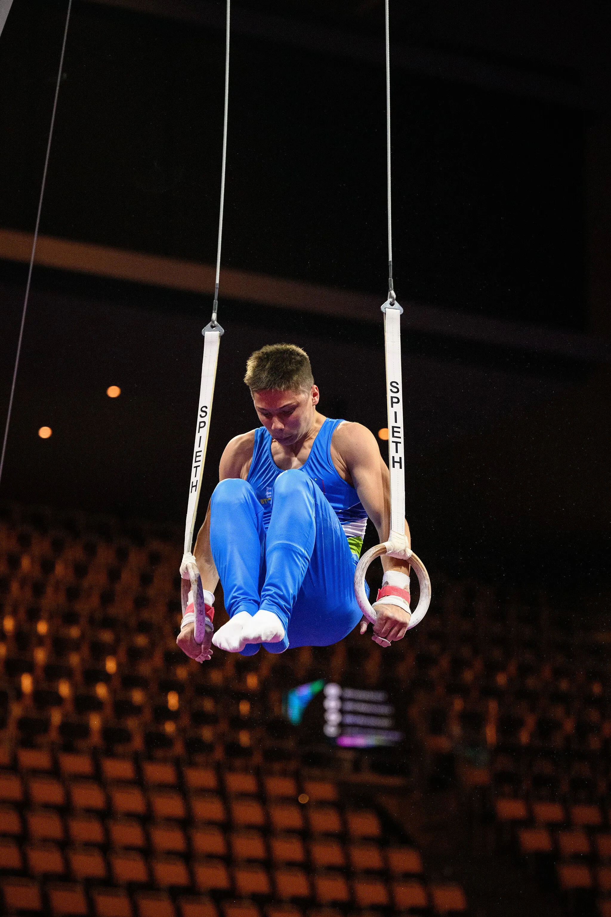 Photo showing: Impressions from Still Rings at Podium Training
2022 European Championships in Men's Artistic Gymnastics (Juniors)
Depicted: Anze Hribar

Photo taken in Olympic Hall Munich on 2022-08-17 18:43:40 18:43:40