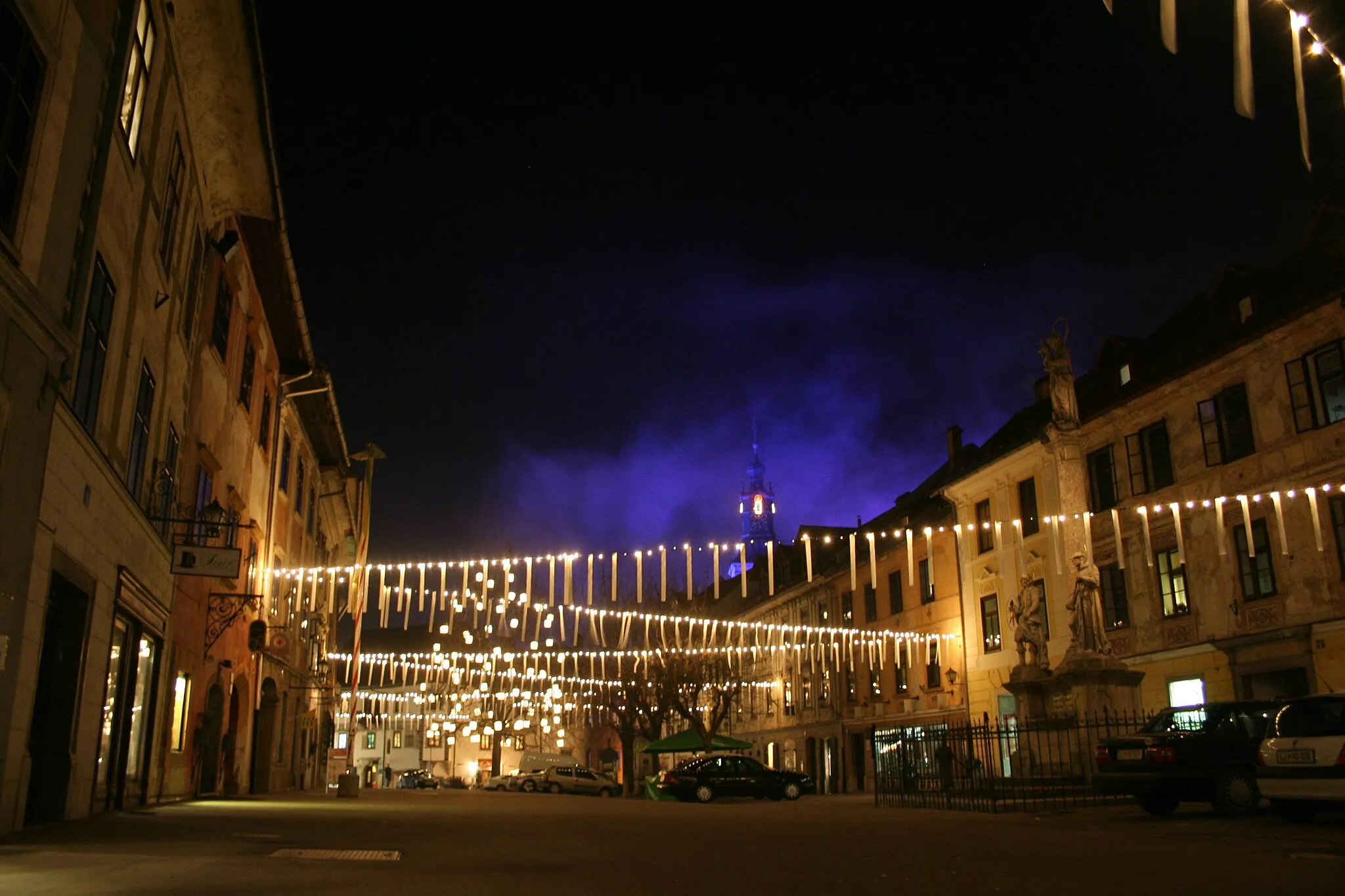 Photo showing: Škofja Loka at night with church tower in background