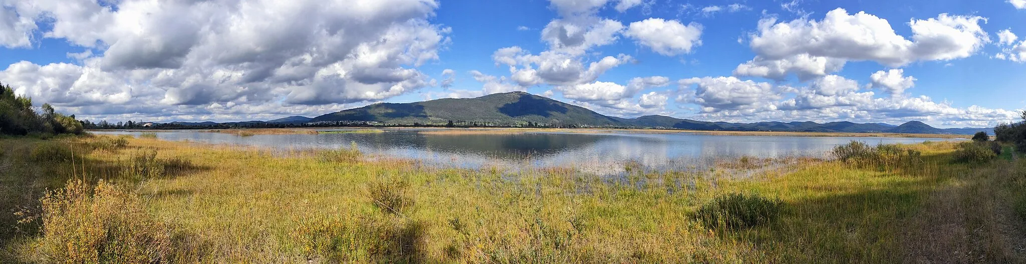 Photo showing: View taken from Goričica over Cerknica Lake and mount Slivnica