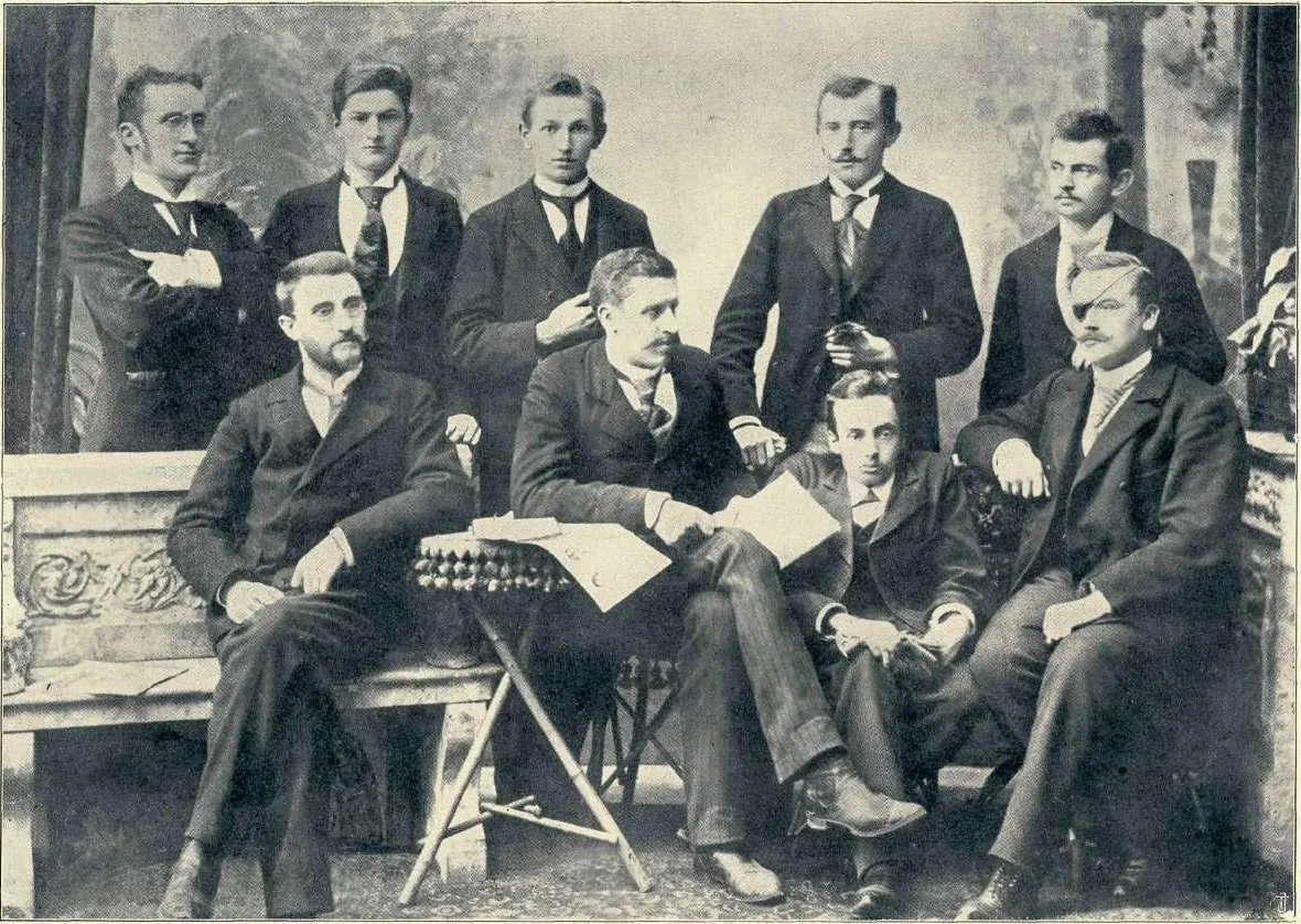 Photo showing: Literar club at Vienna in 1896. (standing: F. Govekar, A. Majaron, O. Župančič, I. škerjanec, I. Cankar, sitting: Fr. Vidic, Fr. Göstl, F. Jančar, F. Eller)