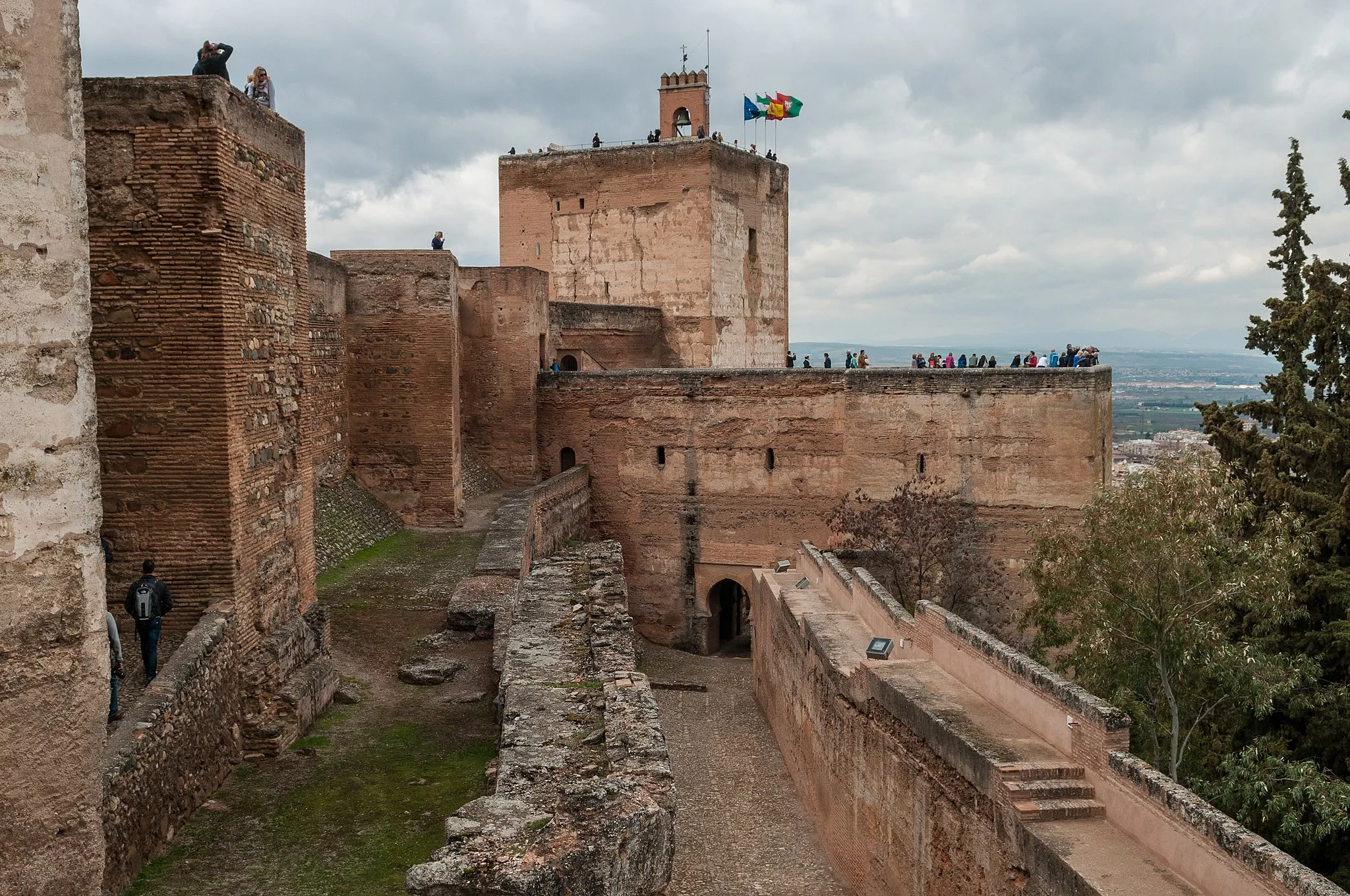 Photo showing: Alhambra, the complete form of which was Calat Alhambra (الْقَلْعَةُ ٱلْحَمْرَاءُ, trans. al-Qal‘at al-Ḥamrā’, "the red fortress"), is a palace and fortress complex located in Granada, Andalusia, Spain. It was constructed during the mid 14th century by the Moorish rulers of the Emirate of Granada in al-Andalus, occupying the top of the hill of the Assabica on the southeastern border of the city of Granada.
The Alhambra's Moorish palaces were built for the last Muslim Emirs in Spain and its court, of the Nasrid dynasty. After the Reconquista (reconquest) by the Reyes Católicos ("Catholic Monarchs") in 1492, some portions were used by the Christian rulers. The Palace of Charles V, built by Charles V, Holy Roman Emperor in 1527, was inserted in the Alhambra within the Nasrid fortifications. After being allowed to fall into disrepair for centuries, the Alhambra was "discovered" in the 19th century by European scholars and travelers, with restorations commencing. It is now one of Spain's major tourist attractions, exhibiting the country's most significant and well known Islamic architecture, together with 16th-century and later Christian building and garden interventions. The Alhambra is a UNESCO World Heritage Site, and the inspiration for many songs and stories.

Alhambra. (2012, April 10). In Wikipedia, The Free Encyclopedia. Retrieved 15:33, April 14, 2012, from en.wikipedia.org/w/index.php?title=Alhambra&oldid=486...