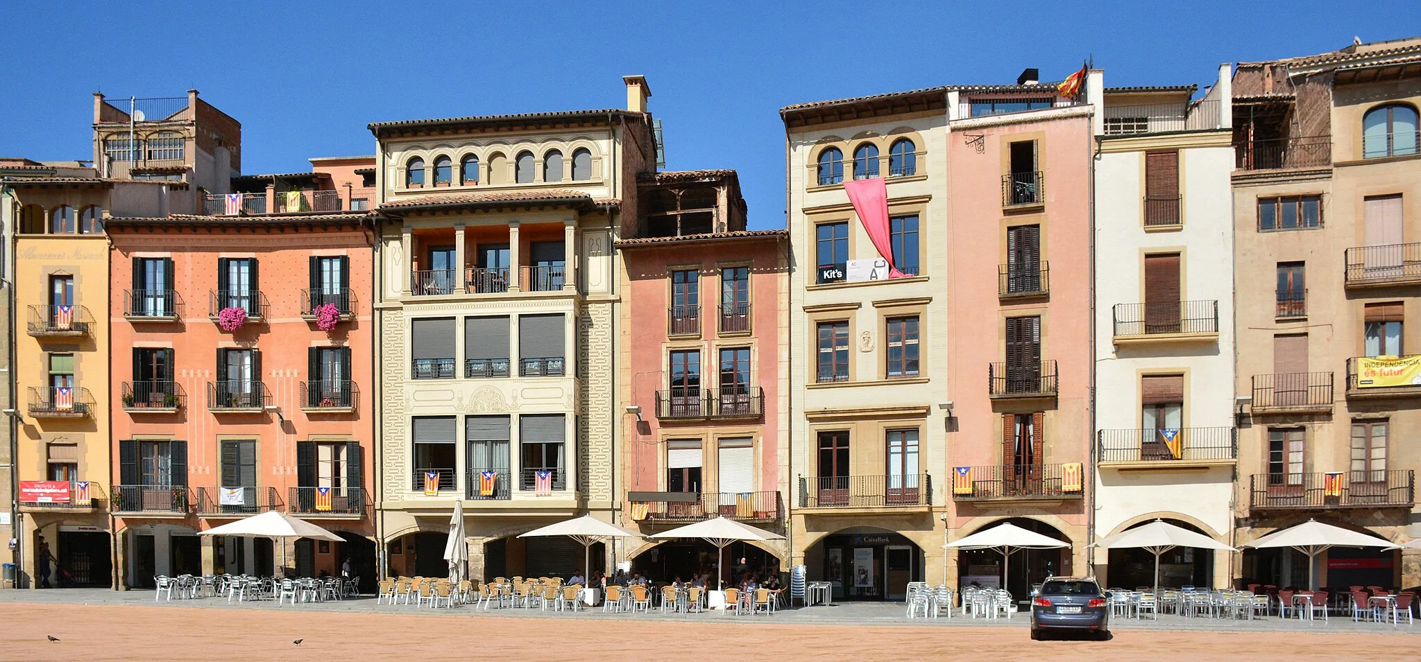 Photo showing: Vic is an important Catalan town with a long history and a rich local culture, lying a few miles north of Barcelona.
Pictured is part of the main square, the Plaça Major, and nearby is the 11th Century cathedral.

Many Catalan flags can be seen. Many Catalonians want to separate from Spain but so far that has not been successful.