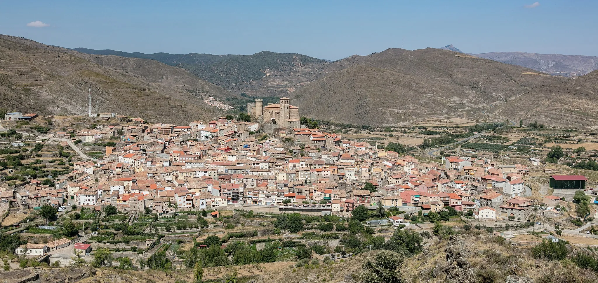 Photo showing: Church and castle of Cornago emerging over the town, La Rioja, Spain