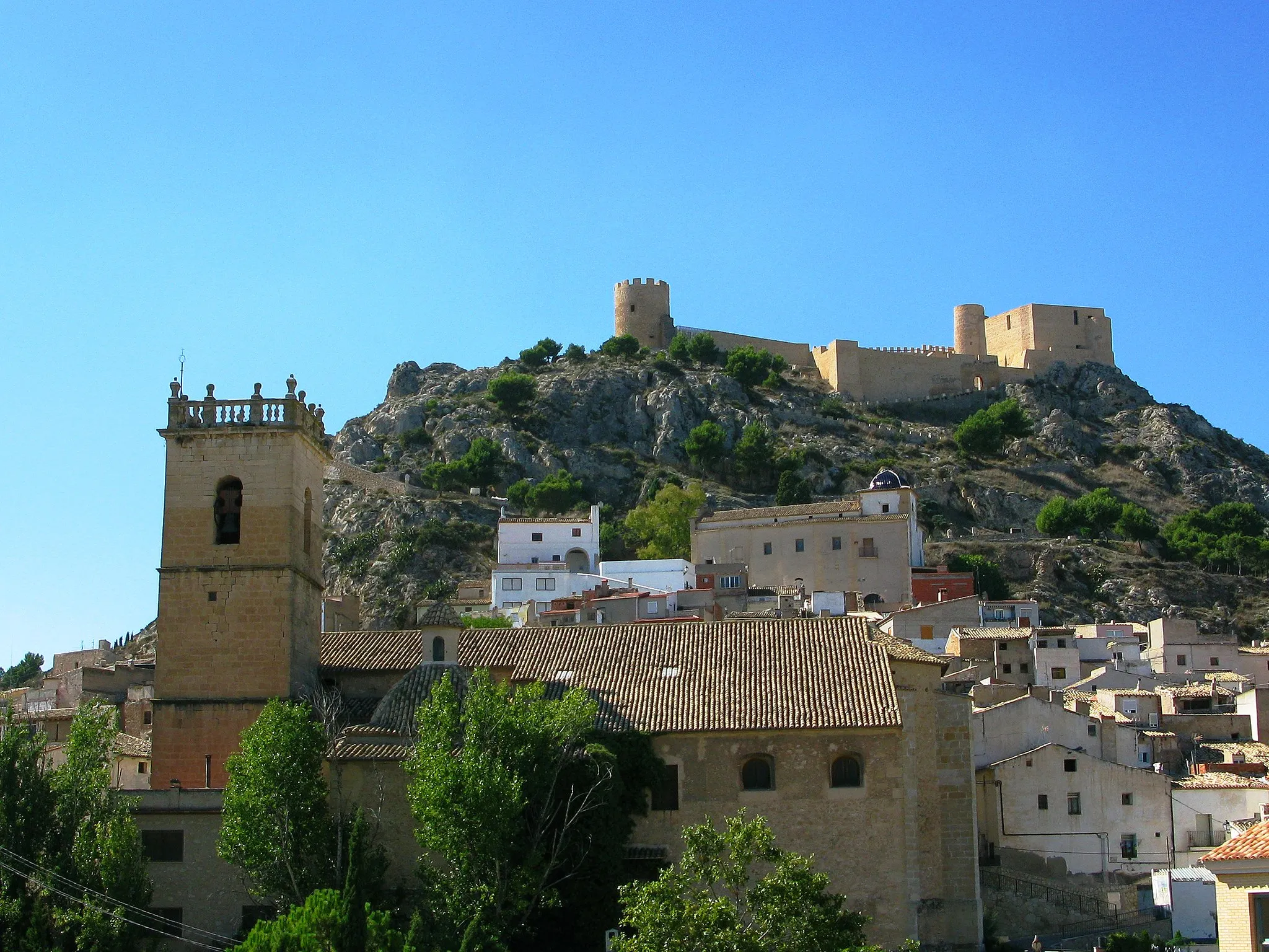 Photo showing: From the bottom up are featured the Church, Ermita & Castle,  3 of the  main historic buildings in Castalla, Alicante region,