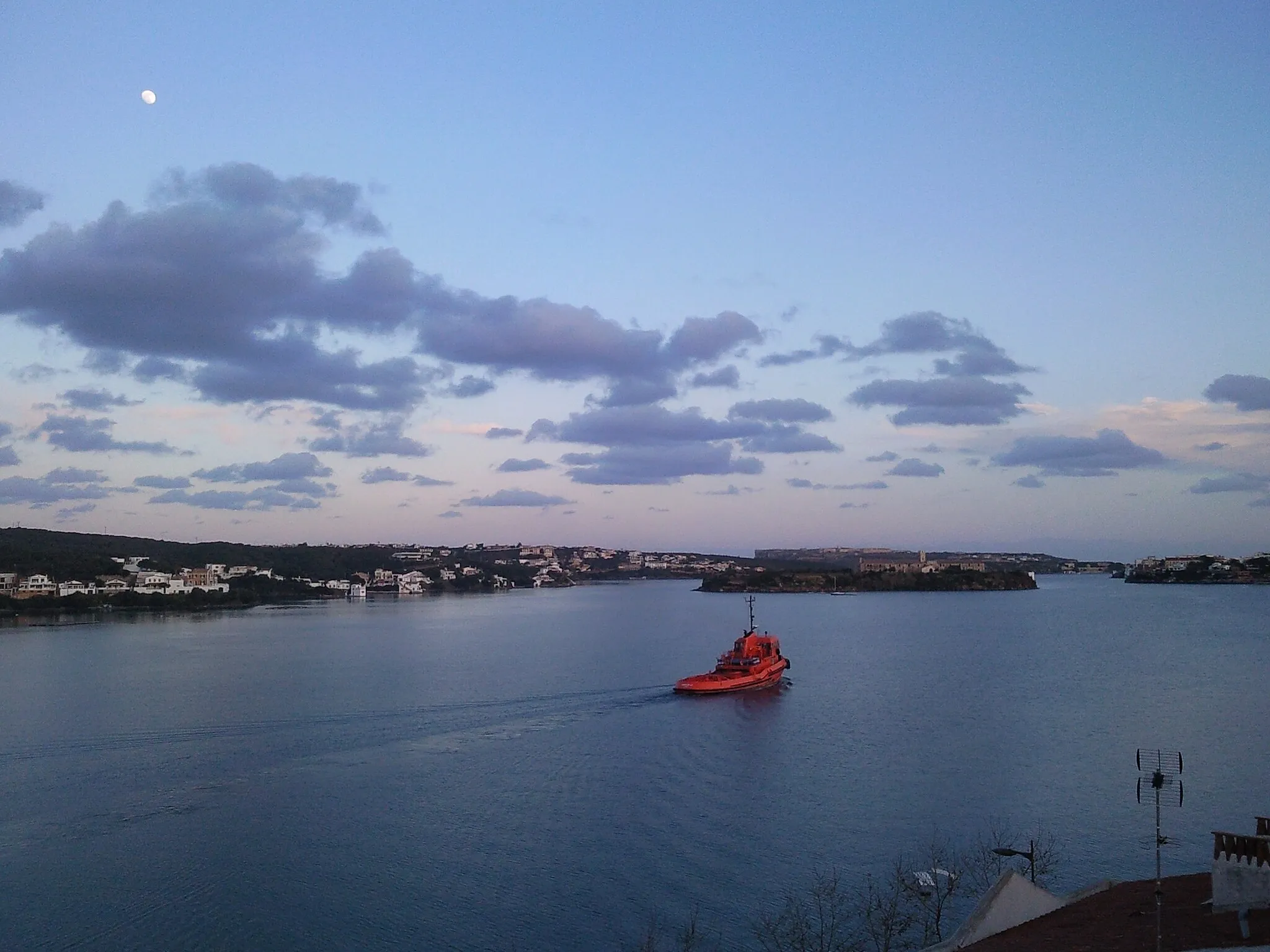 Photo showing: Port Mahon Minorca Orange Boat and Full Moon