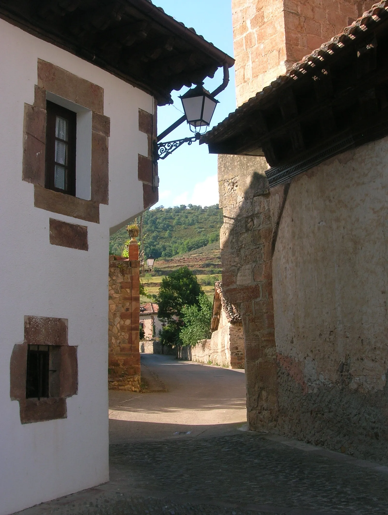 Photo showing: House and church in Ojacastro, La Rioja, Spain