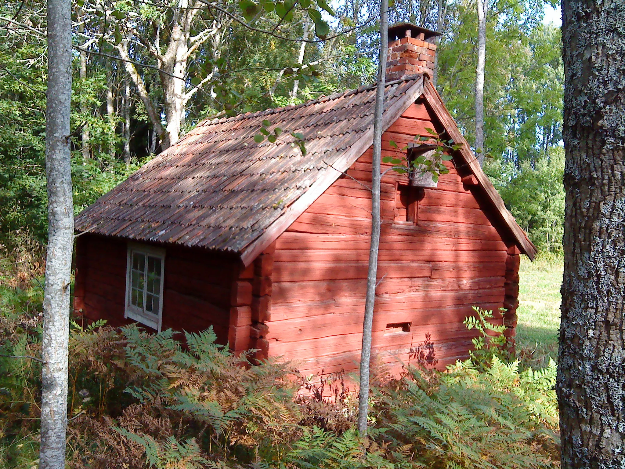 Photo showing: Torkelsbo - old logged building