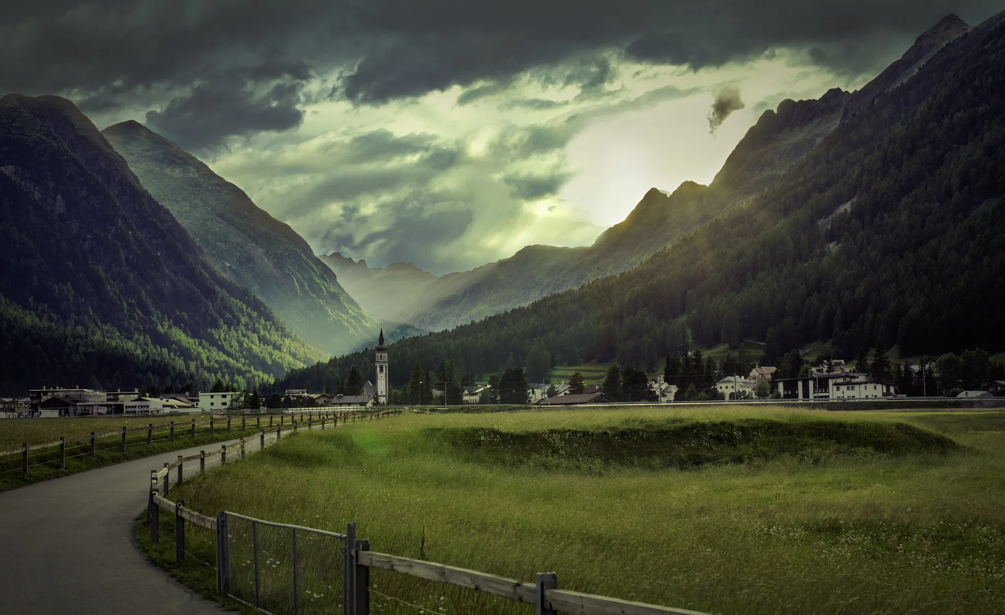 Photo showing: 500px provided description: Evening scenery in the Swiss Alps. [#switzerland ,#mountains ,#sun ,#light ,#clouds ,#road ,#warm ,#landscapes ,#village ,#scenery ,#bevers ,#upper engadine]