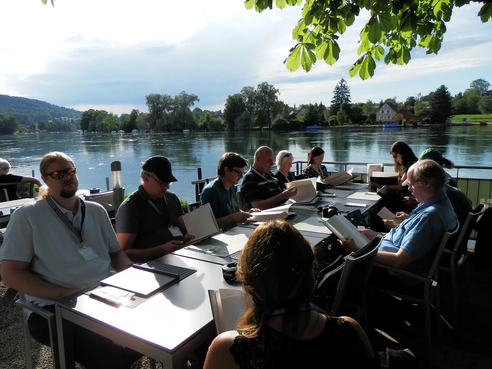 Photo showing: GLAM on Tour Eisenbibliothek 2019, Dinner at Restaurant Paradies (the other shore of the river is Germany)