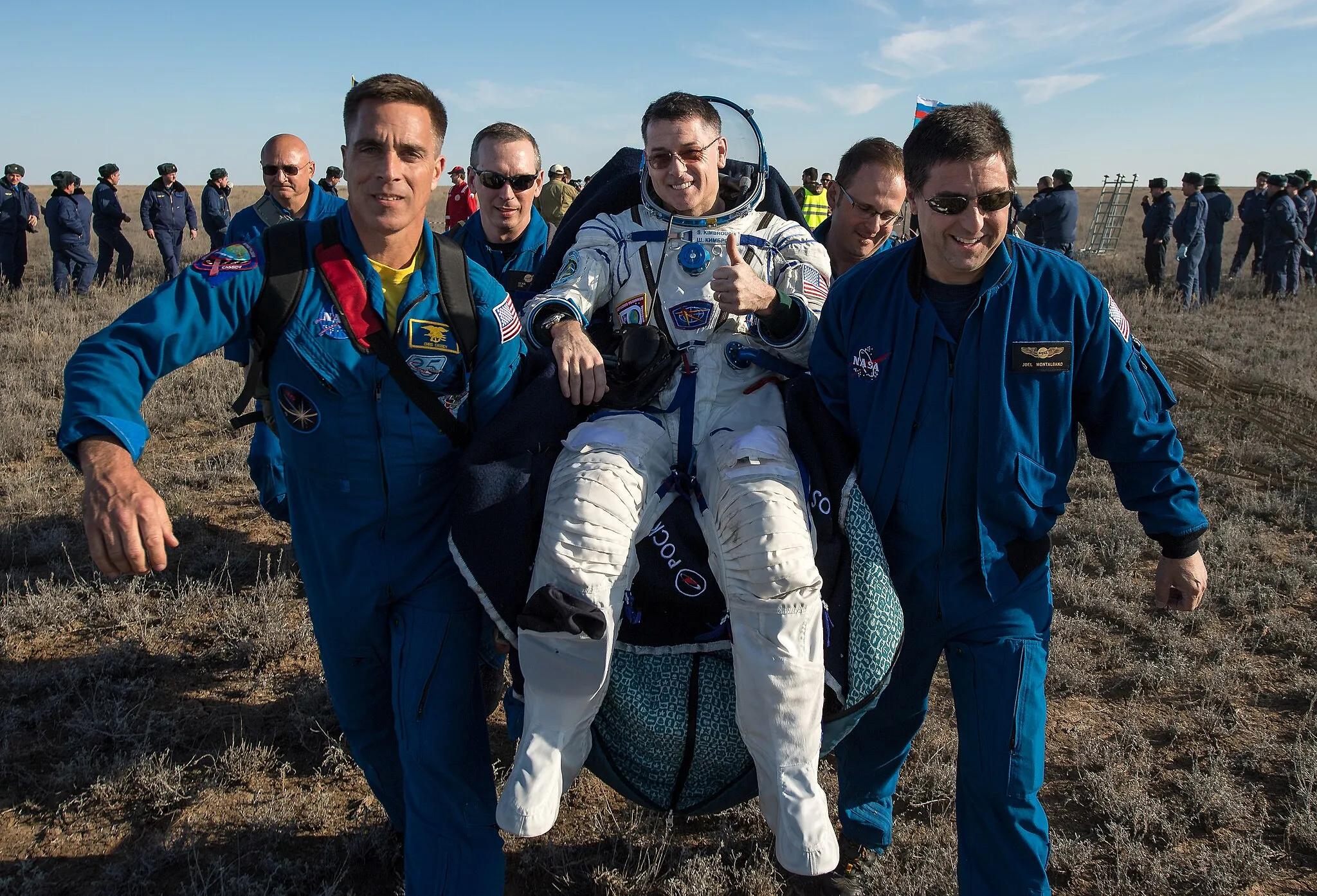Photo showing: NASA astronaut Shane Kimbrough is carried into a medical tent shortly after he, Russian cosmonaut Sergey Ryzhikov of Roscosmos, and Russian cosmonaut Andrey Borisenko of Roscosmos landed in their Soyuz MS-02 spacecraft in a remote area near the town of Zhezkazgan, Kazakhstan on Monday, April 10, 2017 (Kazakh time). Kimbrough, Ryzhikov, and Borisenko are returning after 173 days in space where they served as members of the Expedition 49 and 50 crews onboard the International Space Station.